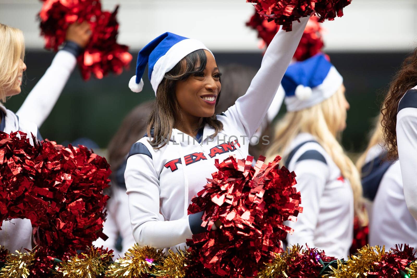 Houston, Texas, USA - November 22, 2018 The H-E-B Thanksgiving Day Parade, Cheerleaders from the Texans NFL Football Team, on a float during the parade