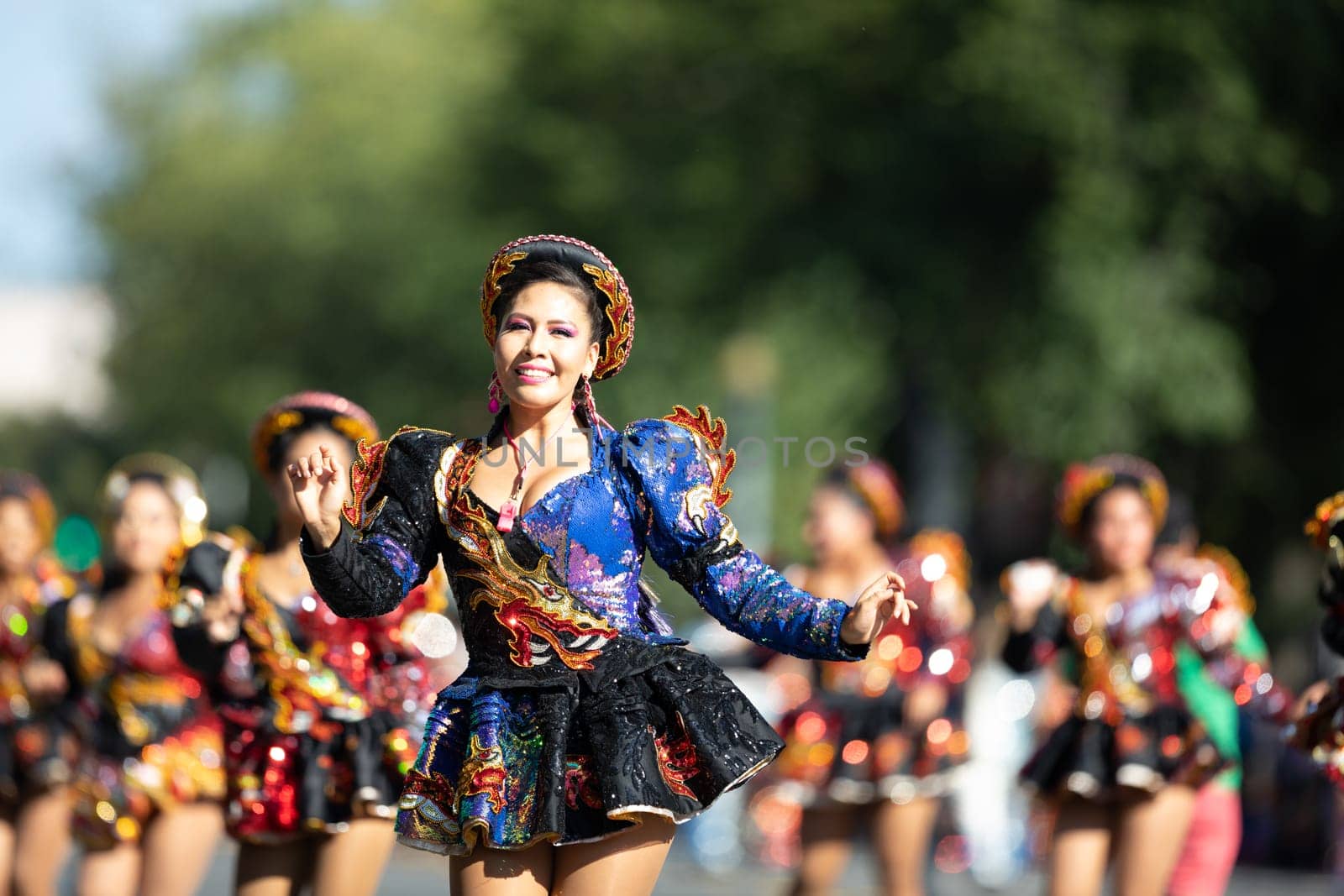 Washington, D.C., USA - September 29, 2018: The Fiesta DC Parade, Bolivian women wearing traditional clothing performing a traditional dance from bolivia