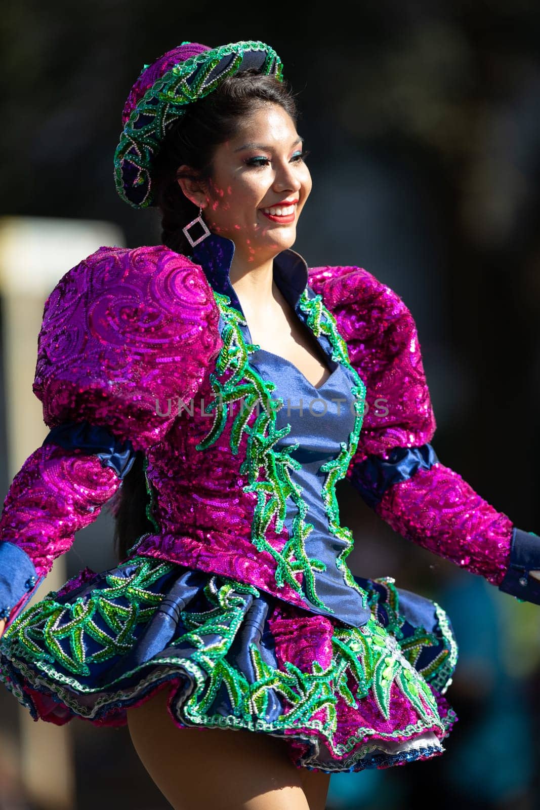Washington, D.C., USA - September 29, 2018: The Fiesta DC Parade, Bolivian women wearing traditional clothing performing a traditional dance from bolivia