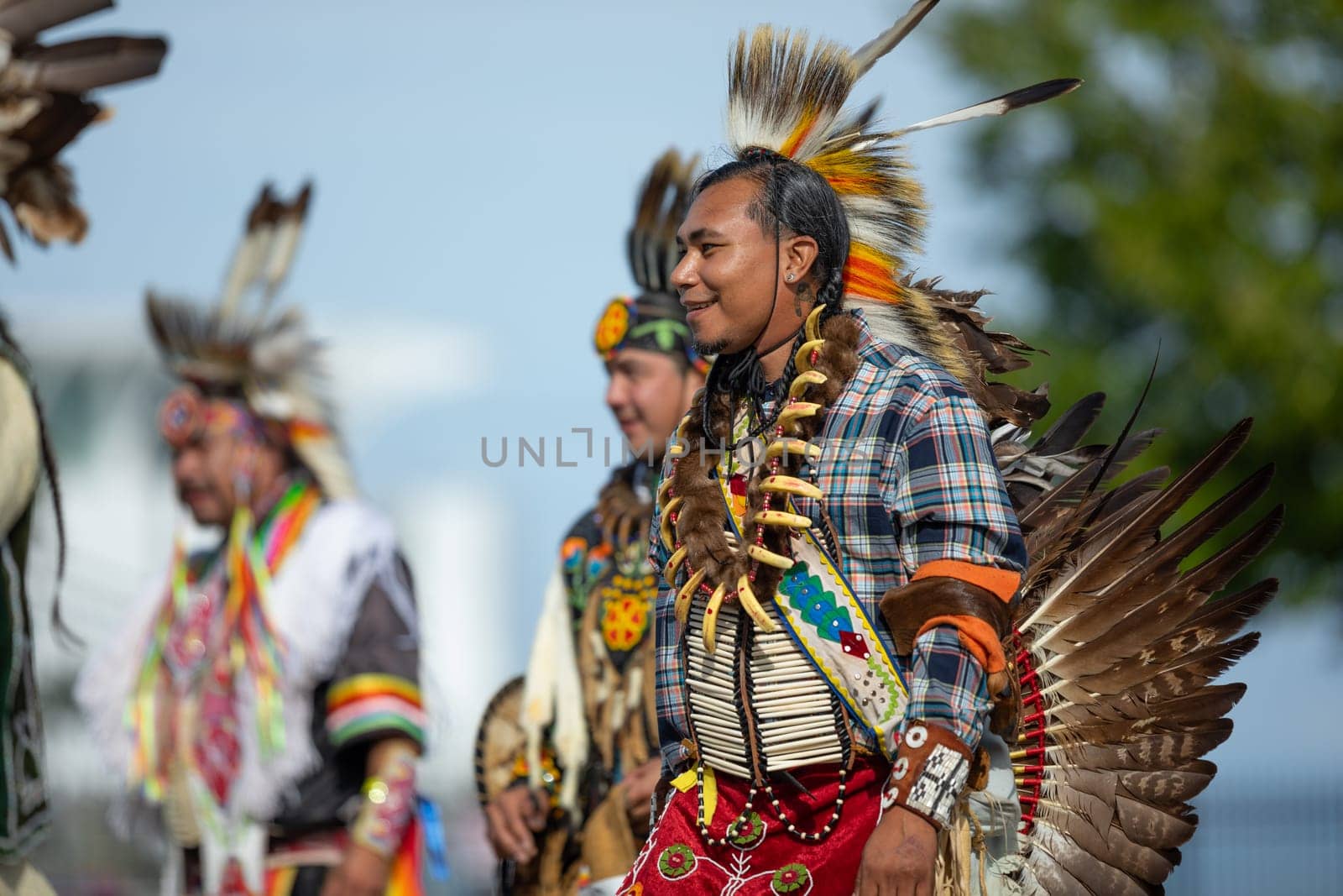 Milwaukee, Wisconsin, USA - September 8, 2018 The Indian Summer Festival Man wearing traditional native american clothing at the pow wow competition.