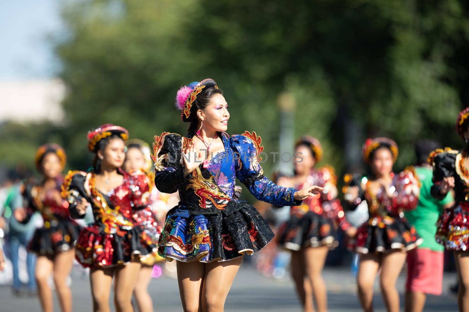 Washington, D.C., USA - September 29, 2018: The Fiesta DC Parade, Bolivian women wearing traditional clothing performing a traditional dance from bolivia