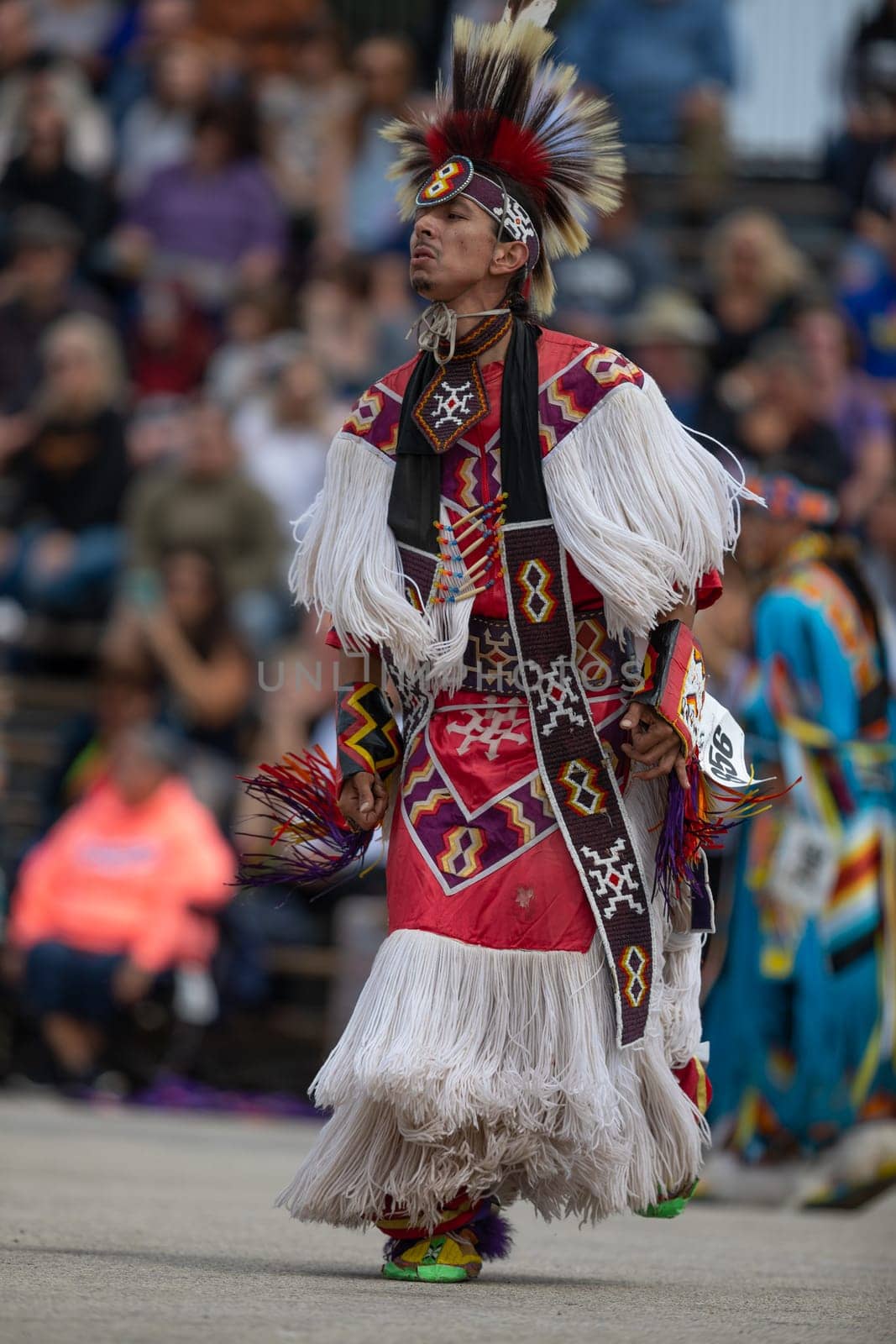Milwaukee, Wisconsin, USA - September 8, 2018 The Indian Summer Festival, Man wearing traditional native american clothing, dancing at the pow wow competition.