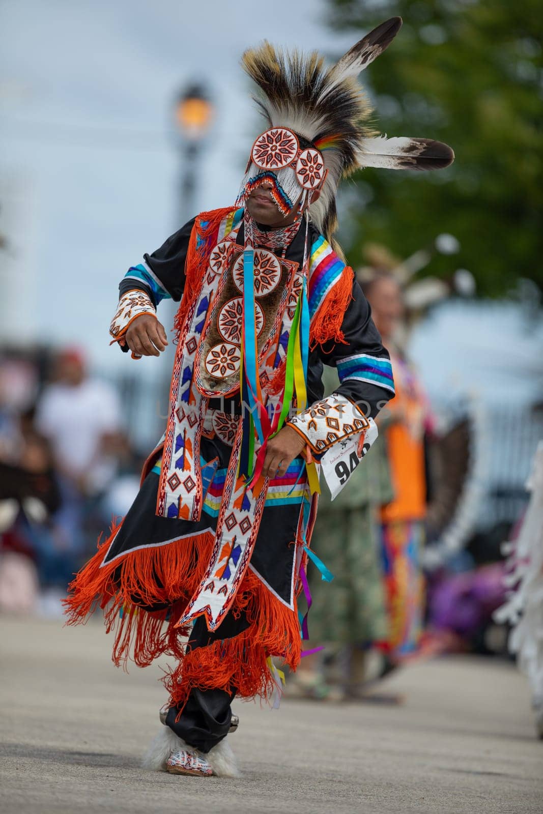 Milwaukee, Wisconsin, USA - September 8, 2018 The Indian Summer Festival, Man wearing traditional native american clothing, dancing at the pow wow competition.