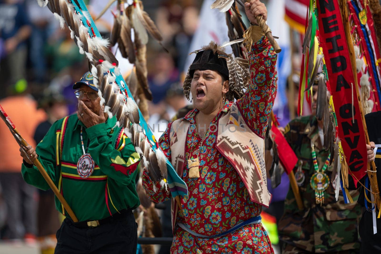 Milwaukee, Wisconsin, USA - September 8, 2018 The Indian Summer Festival, Men and women wearing traditional native american clothing in the ceremony honoring native american military veterans