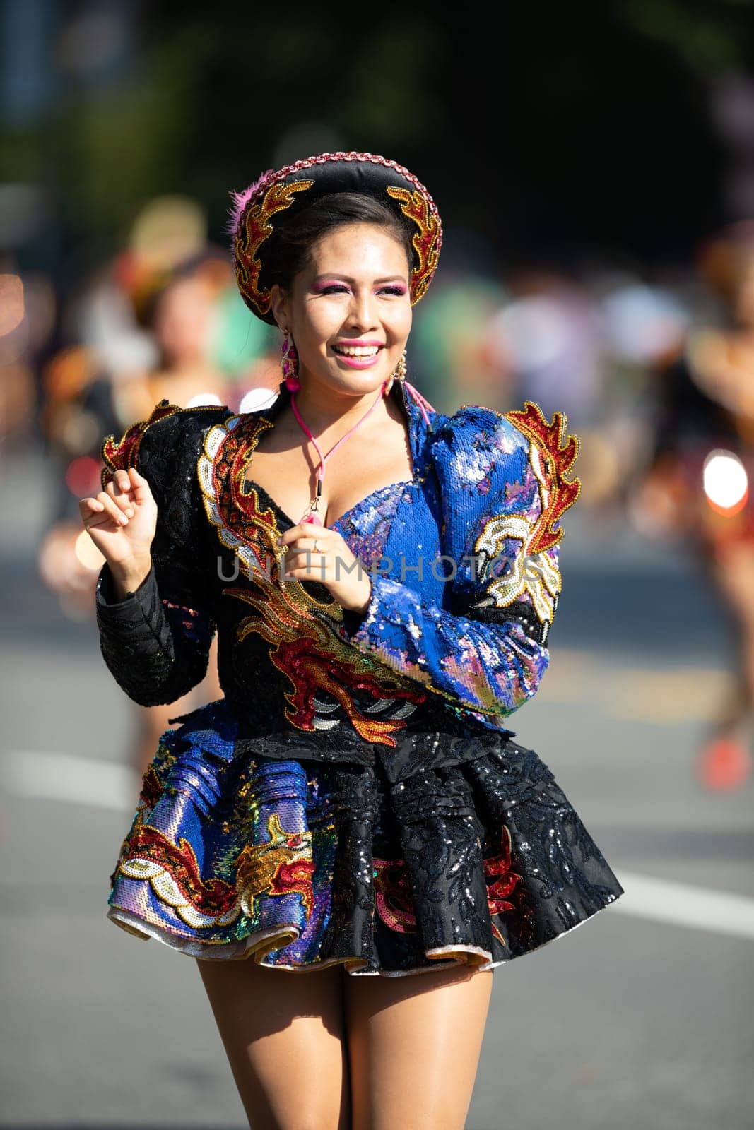 Washington, D.C., USA - September 29, 2018: The Fiesta DC Parade, Bolivian women wearing traditional clothing performing a traditional dance from bolivia