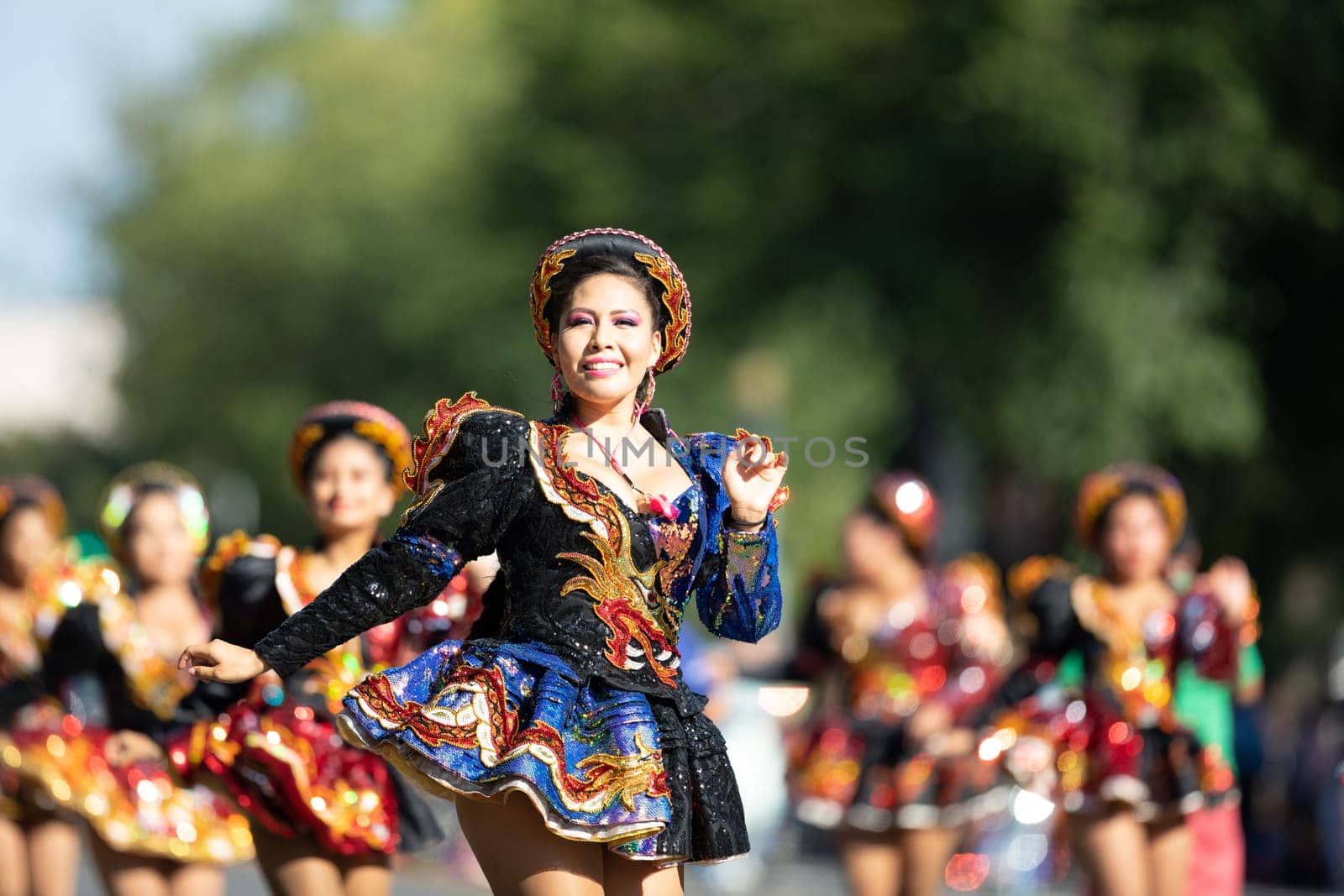Washington, D.C., USA - September 29, 2018: The Fiesta DC Parade, Bolivian women wearing traditional clothing performing a traditional dance from bolivia