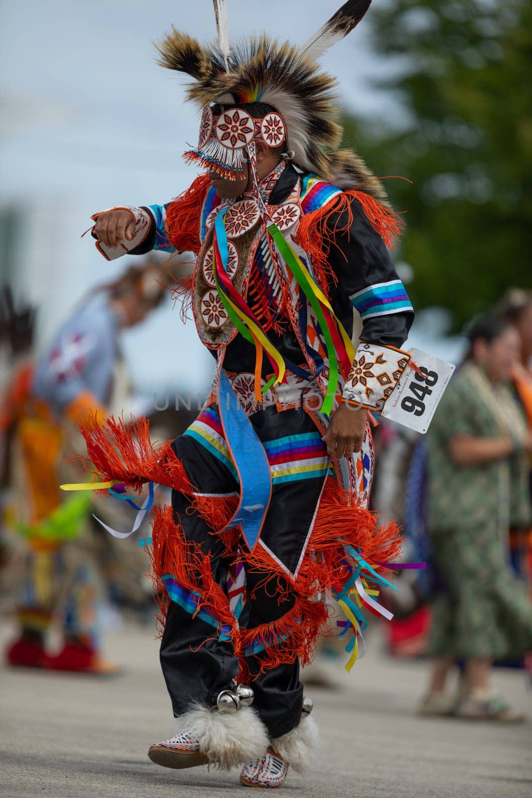 Milwaukee, Wisconsin, USA - September 8, 2018 The Indian Summer Festival, Man wearing traditional native american clothing, dancing at the pow wow competition.