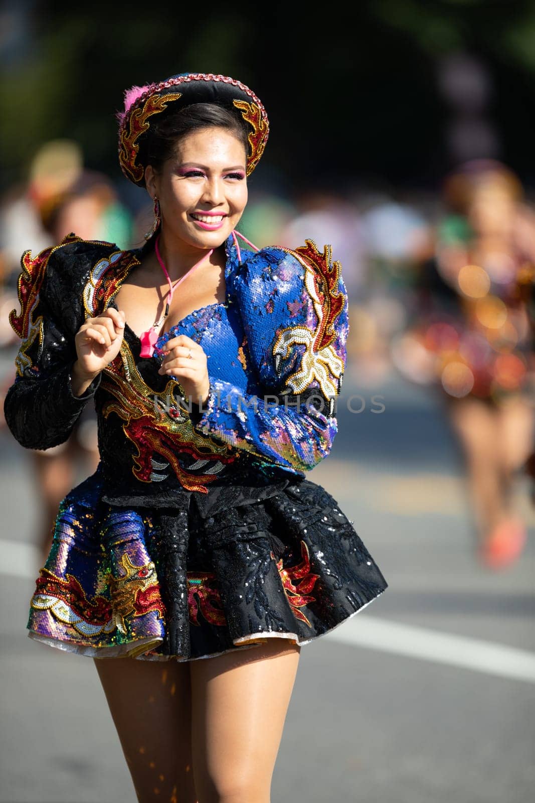 Washington, D.C., USA - September 29, 2018: The Fiesta DC Parade, Bolivian women wearing traditional clothing performing a traditional dance from bolivia