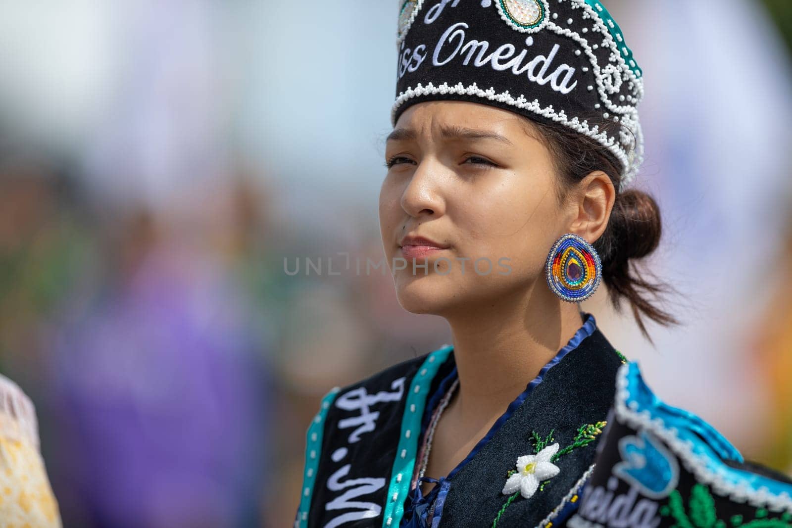 Milwaukee, Wisconsin, USA - September 8, 2018 The Indian Summer Festival Young woman wearing traditional native american clothing at the pow wow competition.