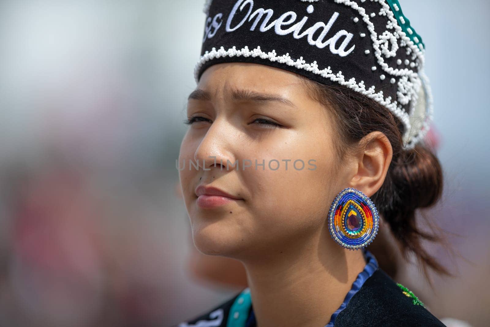 Milwaukee, Wisconsin, USA - September 8, 2018 The Indian Summer Festival Young woman wearing traditional native american clothing at the pow wow competition.