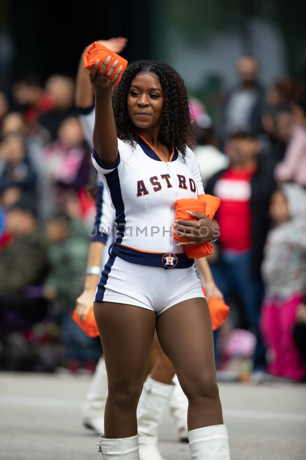 Houston, Texas, USA - November 22, 2018 The H-E-B Thanksgiving Day Parade, Cheerleaders from the Astros Baseball team giving spectators free shirts