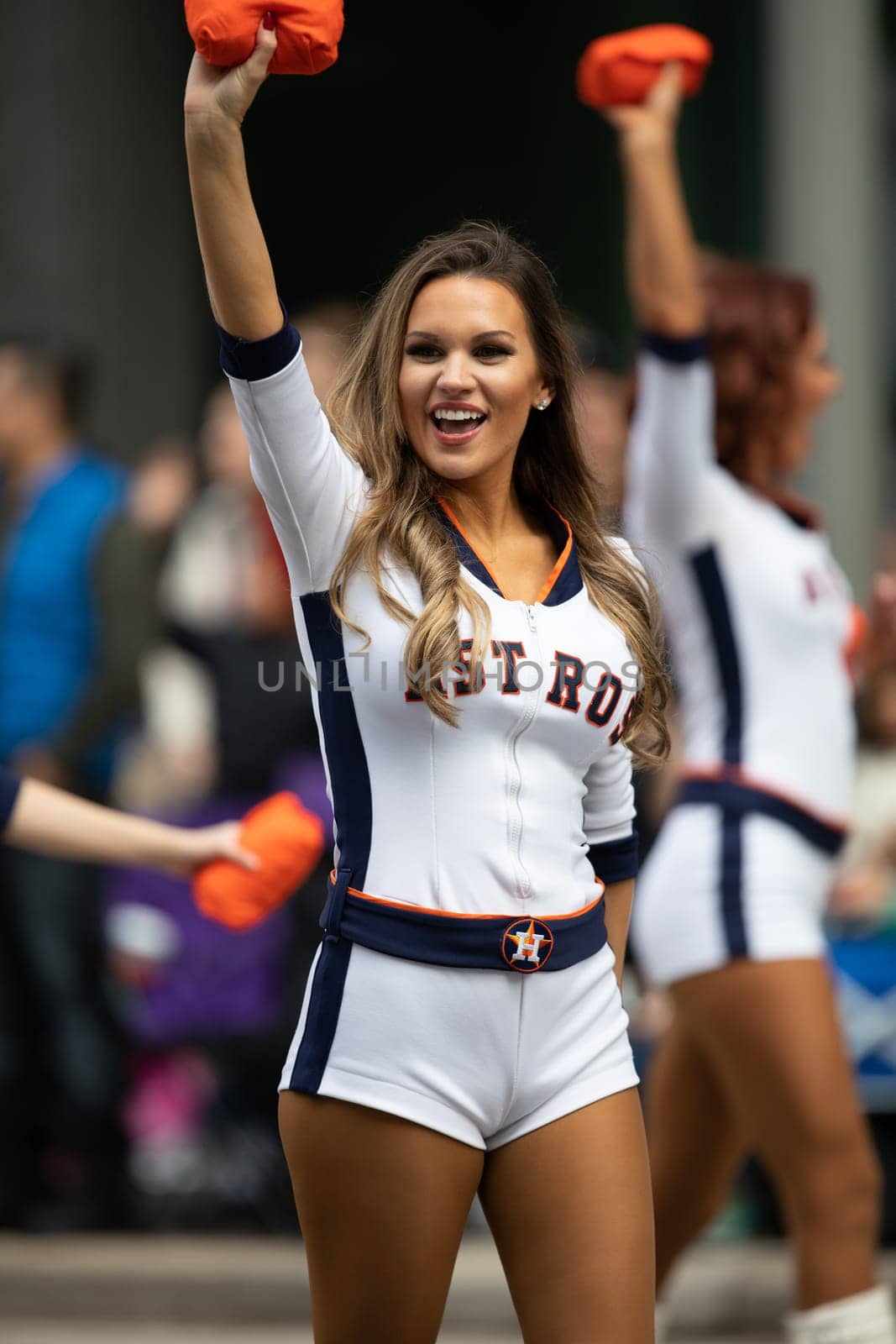 Houston, Texas, USA - November 22, 2018 The H-E-B Thanksgiving Day Parade, Cheerleaders from the Astros Baseball team giving spectators free shirts