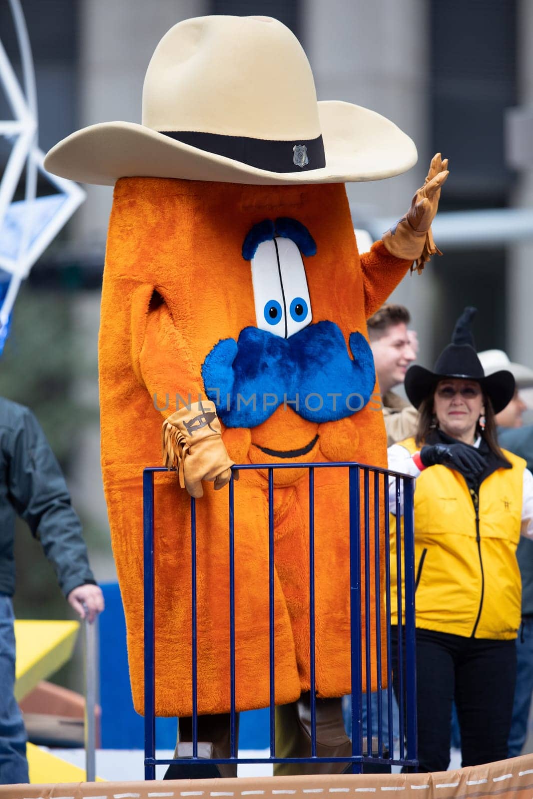 Houston, Texas, USA - November 22, 2018 The H-E-B Thanksgiving Day Parade, The Houston Livestock show and rodeo mascot riding on a float wearing a giant cowboy hat