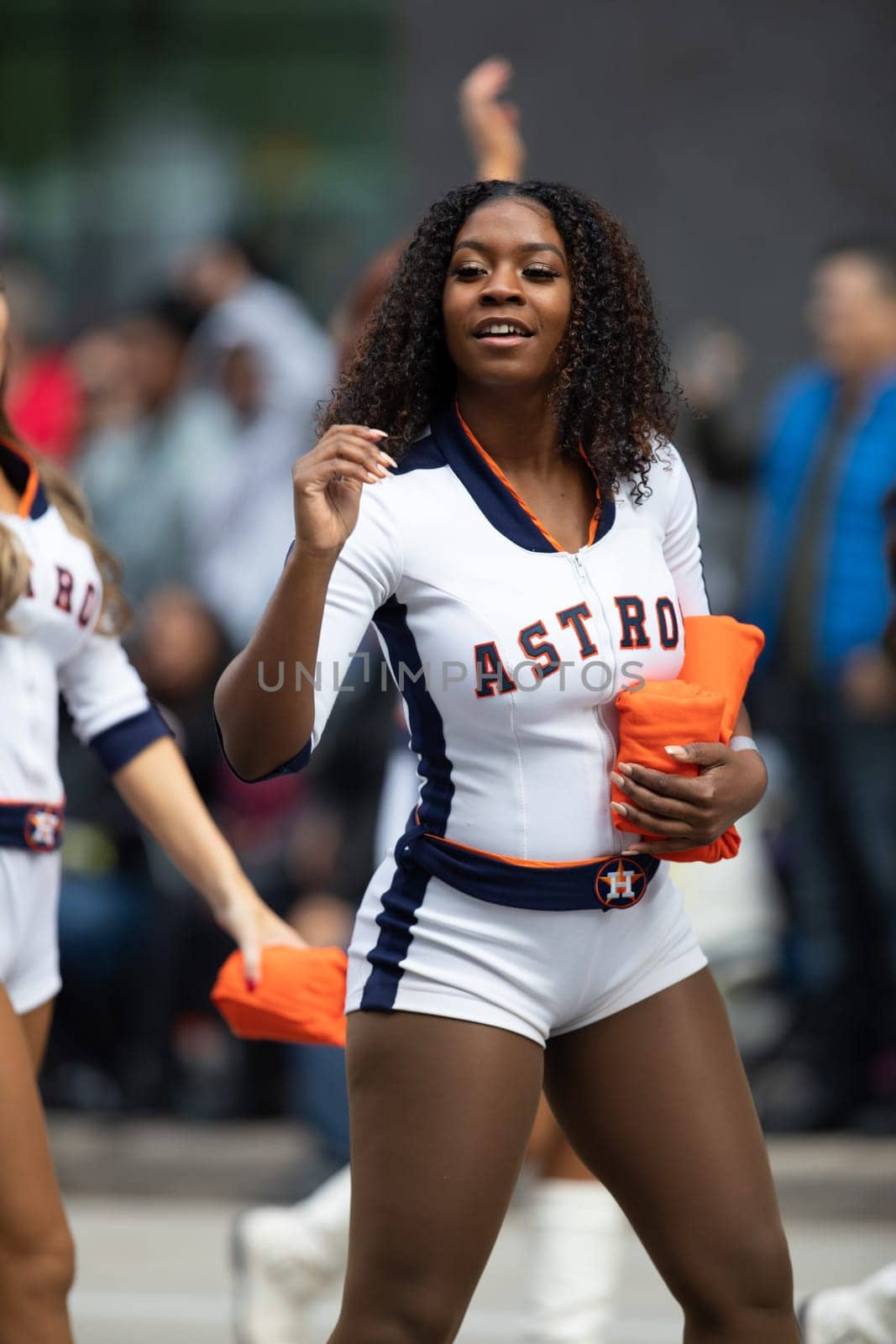 Houston, Texas, USA - November 22, 2018 The H-E-B Thanksgiving Day Parade, Cheerleaders from the Astros Baseball team giving spectators free shirts