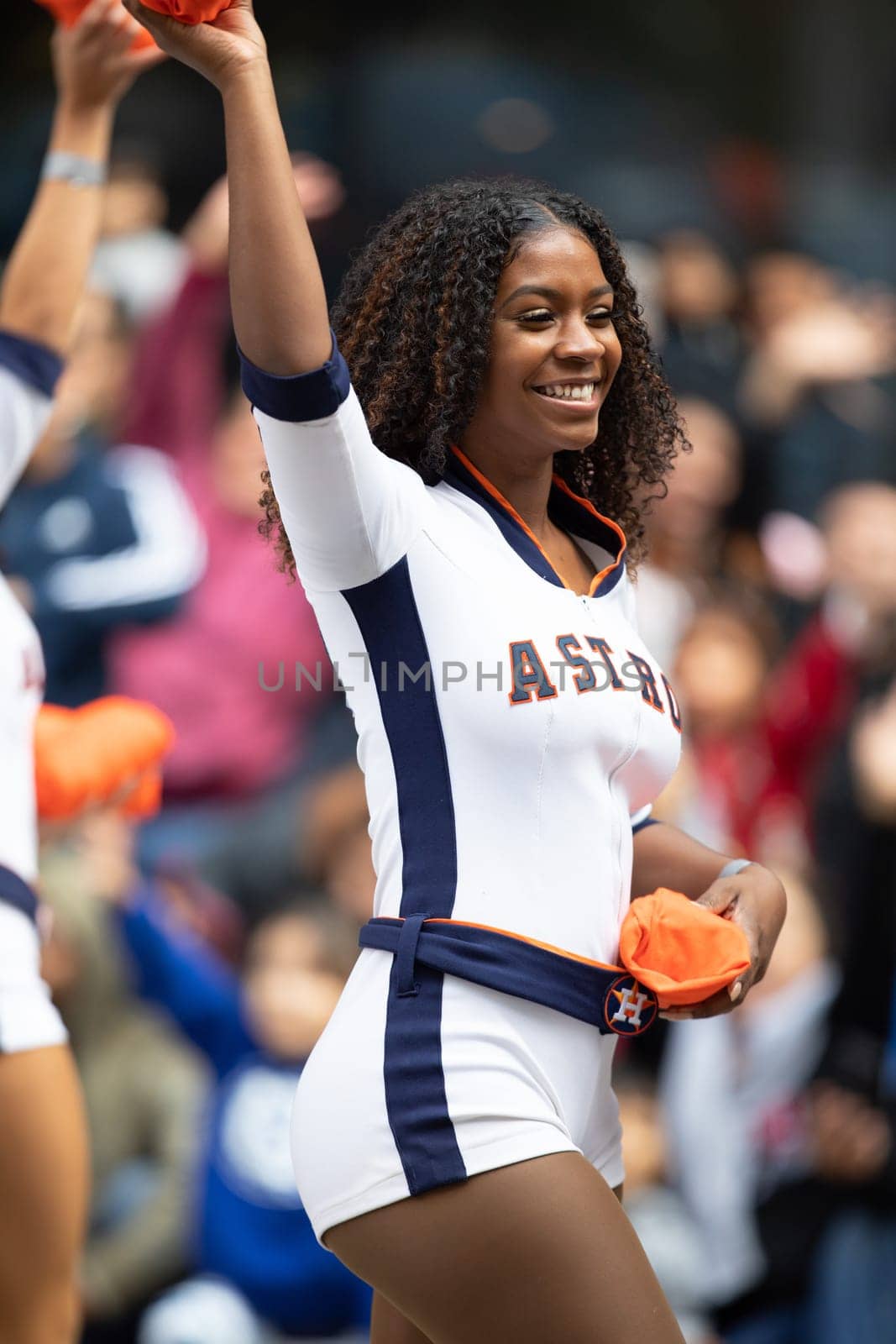 Houston, Texas, USA - November 22, 2018 The H-E-B Thanksgiving Day Parade, Cheerleaders from the Astros Baseball team giving spectators free shirts