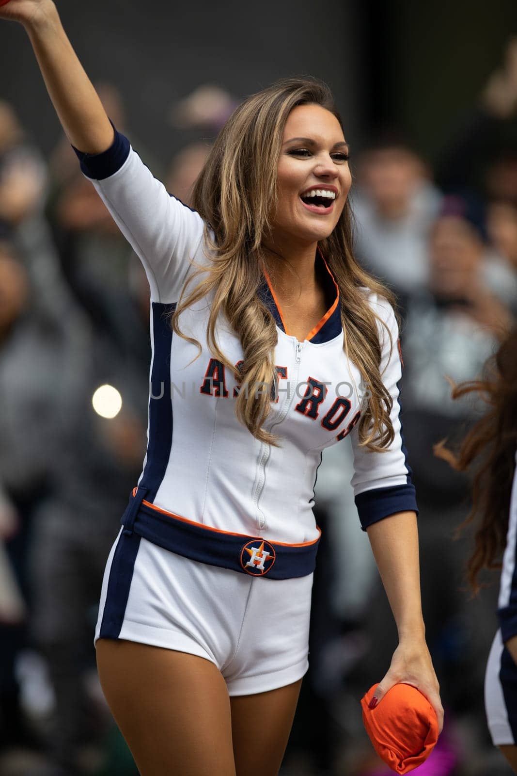 Houston, Texas, USA - November 22, 2018 The H-E-B Thanksgiving Day Parade, Cheerleaders from the Astros Baseball team giving spectators free shirts