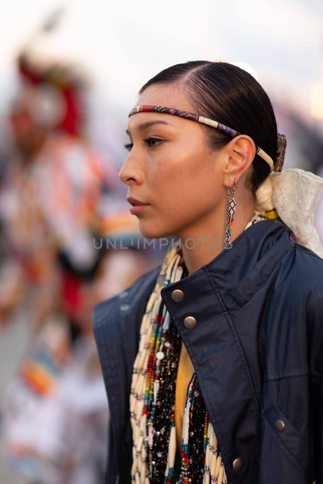 Milwaukee, Wisconsin, USA - September 8, 2018 The Indian Summer Festival Young woman wearing traditional native american clothing at the pow wow competition.