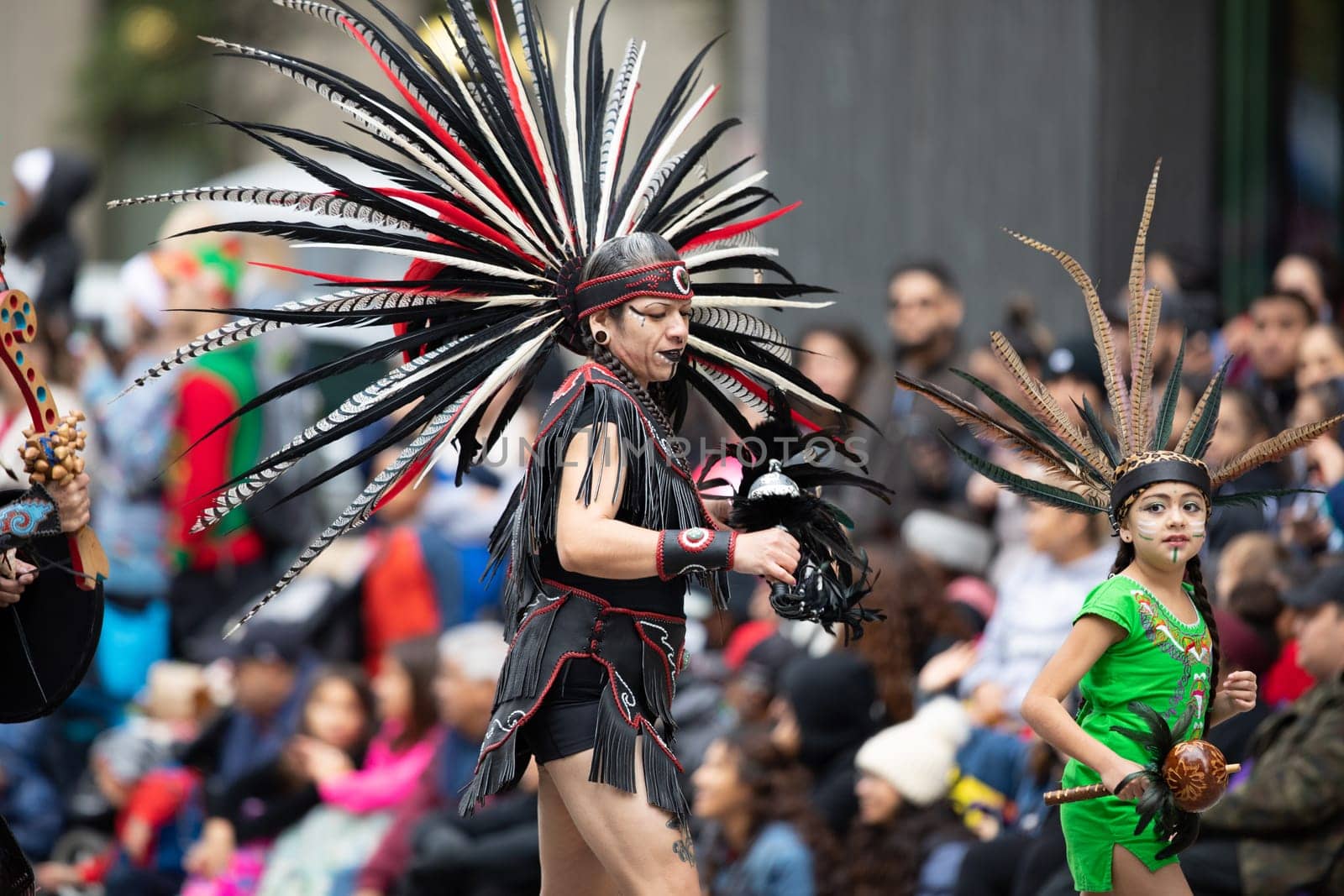 Houston, Texas, USA - November 22, 2018 The H-E-B Thanksgiving Day Parade, Men and women wearing aztec clothing dancing at the parade
