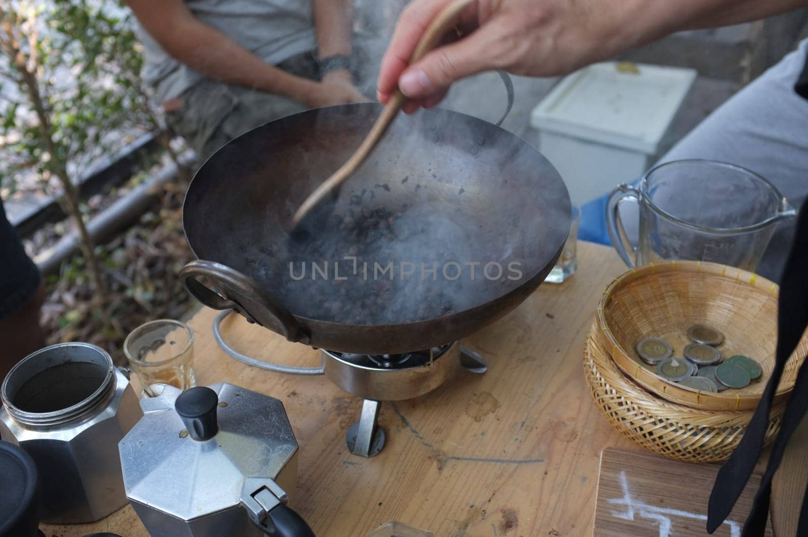 The man roasted coffee beans in pan