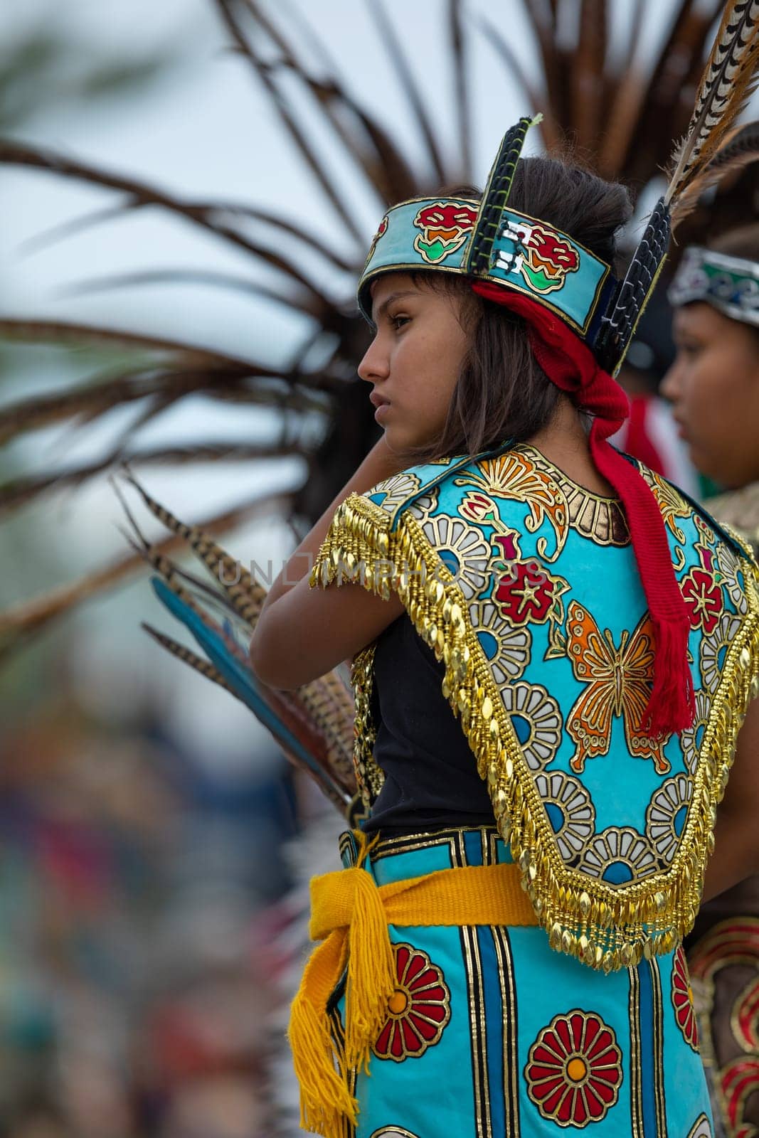 Milwaukee, Wisconsin, USA - September 8, 2018 The Indian Summer Festival, Girl wearing traditional aztec clothing at the Pow Wow competition.