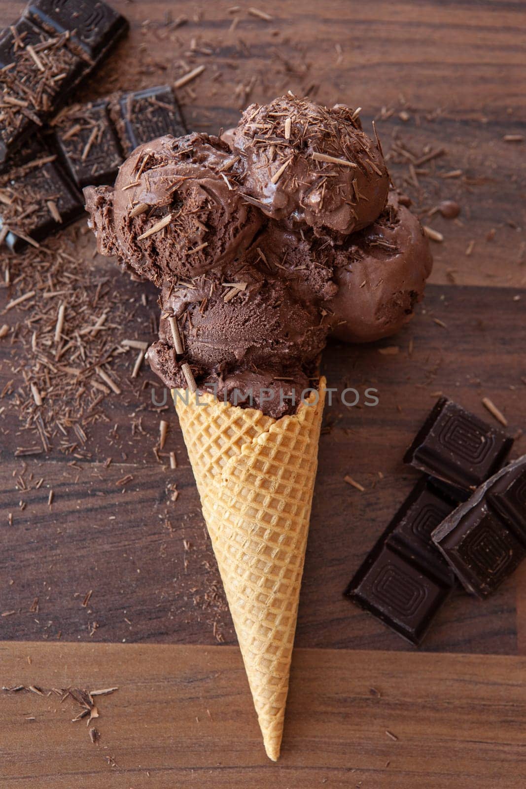 Waffled cones in basket with rich dark chocolate ice cream