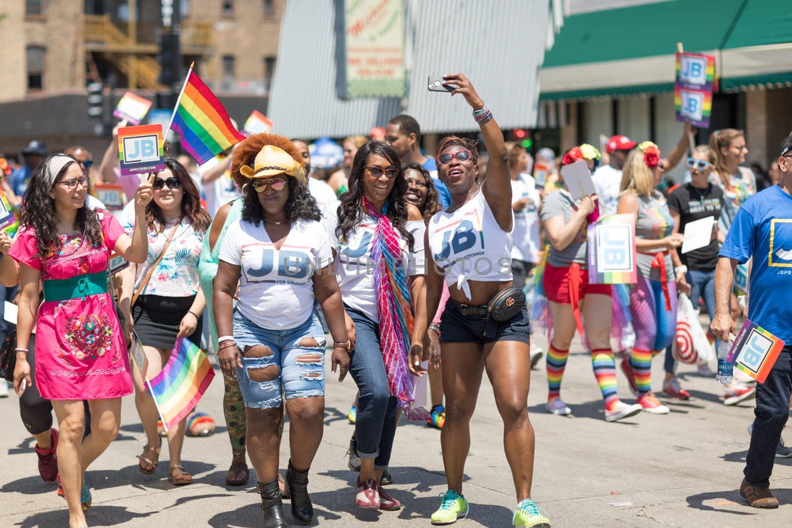 Chicago, Illinois, USA - June 24, 2018 People promoting J. B. Pritzker for governor during the LGBTQ Pride Parade in Chicago