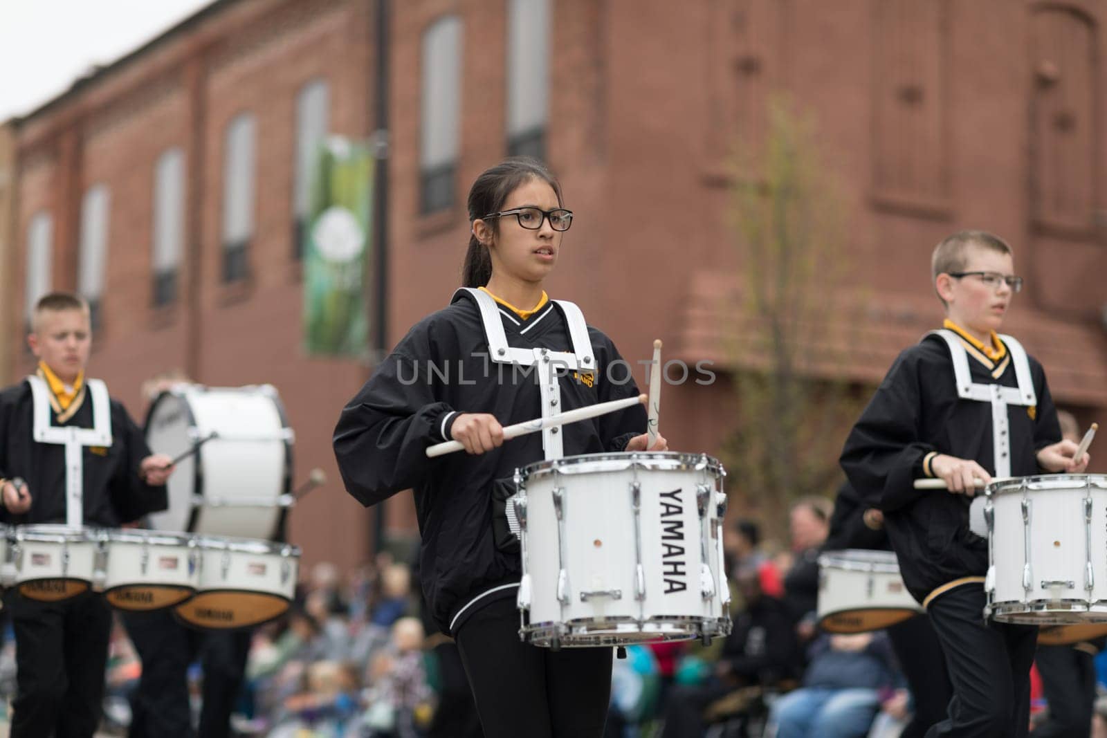 Holland, Michigan, USA - May 12, 2018 Members of the Hamilton Middle School marching band perform at the Muziek Parade, during the Tulip Time Festival