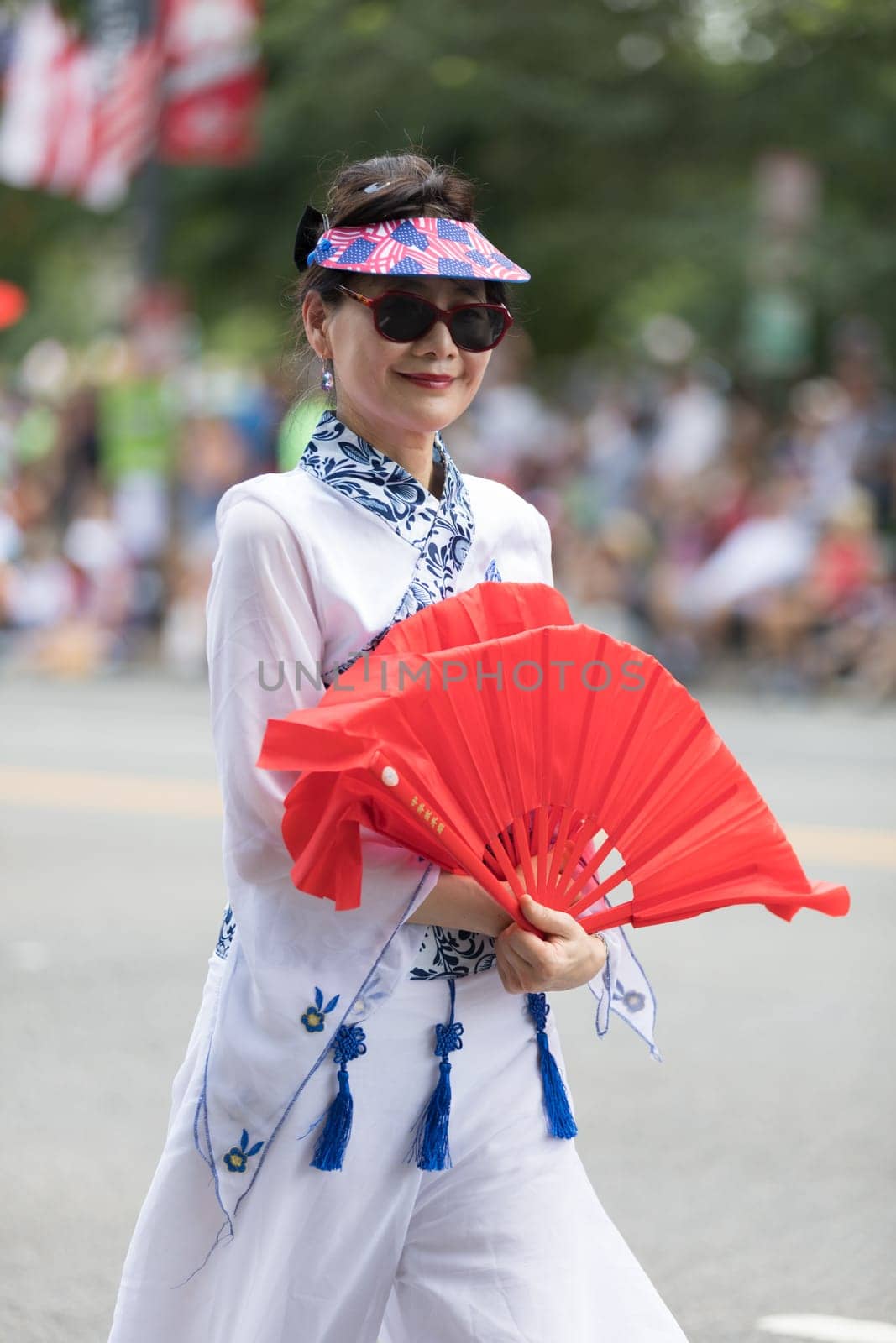 Washington, D.C., USA - July 4, 2018, The National Independence Day Parade, Taiwanese women wearing traditional clothing, walking down constitution avenue during the parade