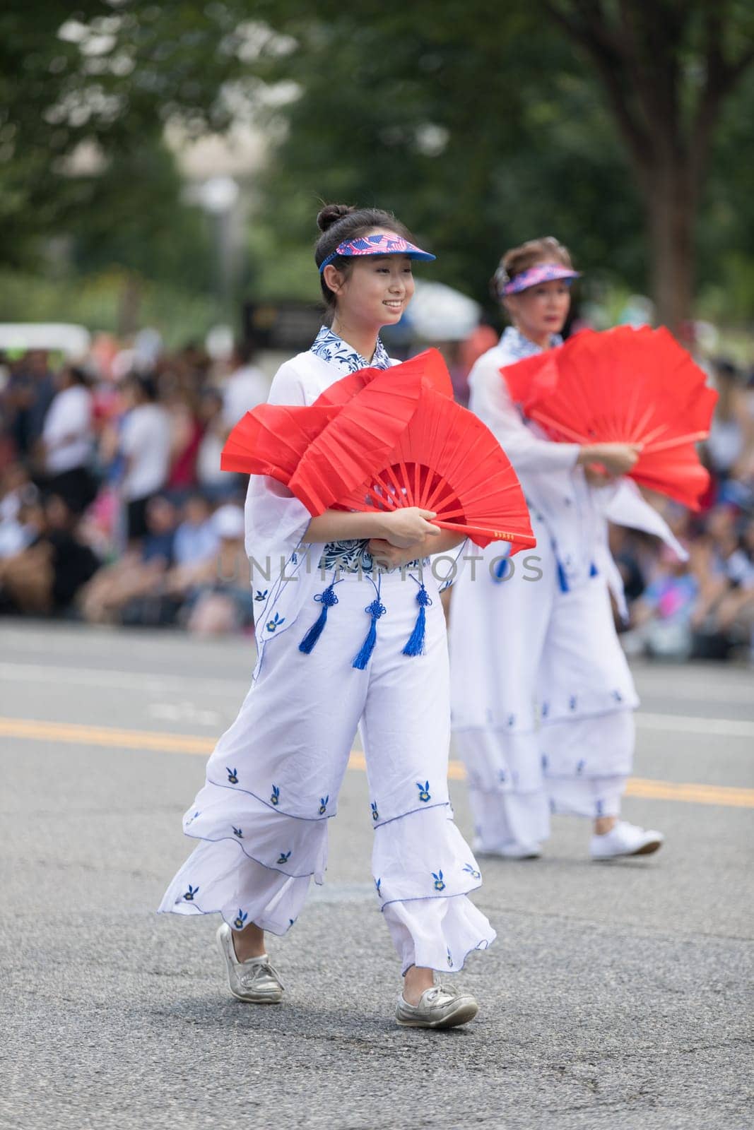 Washington, D.C., USA - July 4, 2018, The National Independence Day Parade, Taiwanese women wearing traditional clothing, walking down constitution avenue during the parade