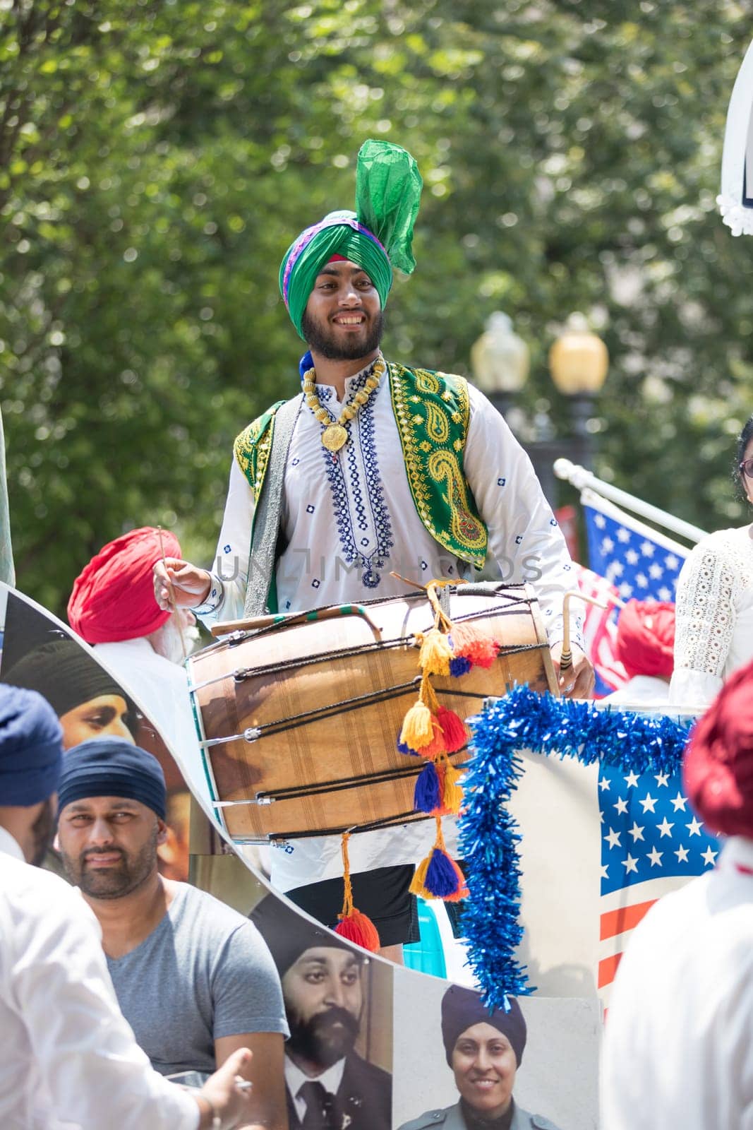 Washington, D.C., USA - July 4, 2018, The National Independence Day Parade, The Sikhs of America, waving american flags, going down constitution avenue during the parade