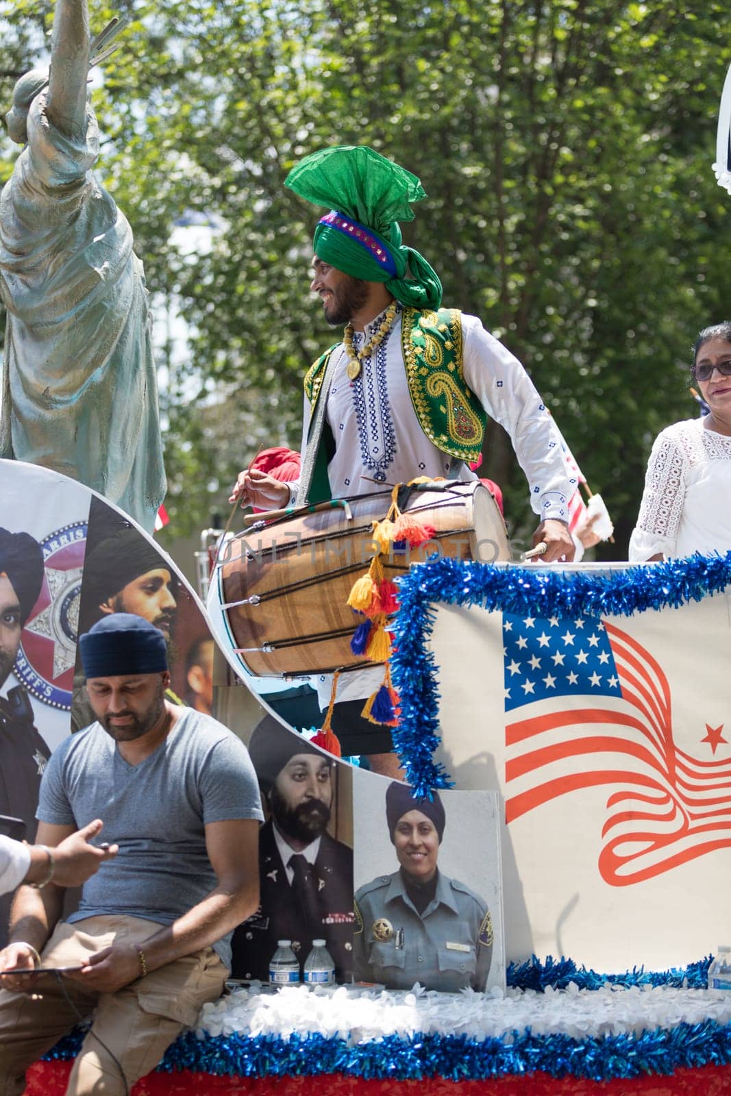 Washington, D.C., USA - July 4, 2018, The National Independence Day Parade, The Sikhs of America, waving american flags, going down constitution avenue during the parade