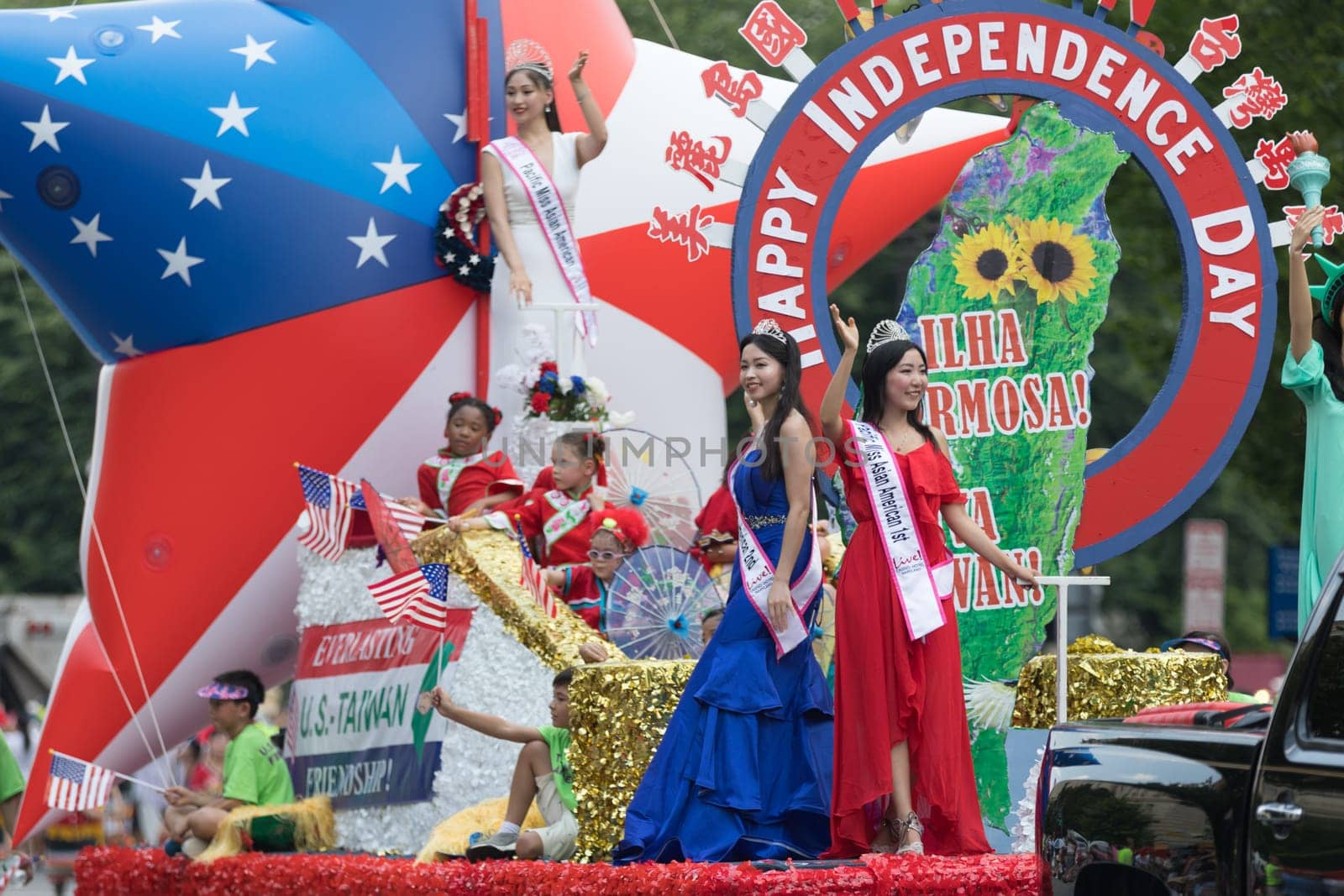 Washington, D.C., USA - July 4, 2018, The National Independence Day Parade, Taiwanese beauty queens on a float, going down constitution avenue during the parade