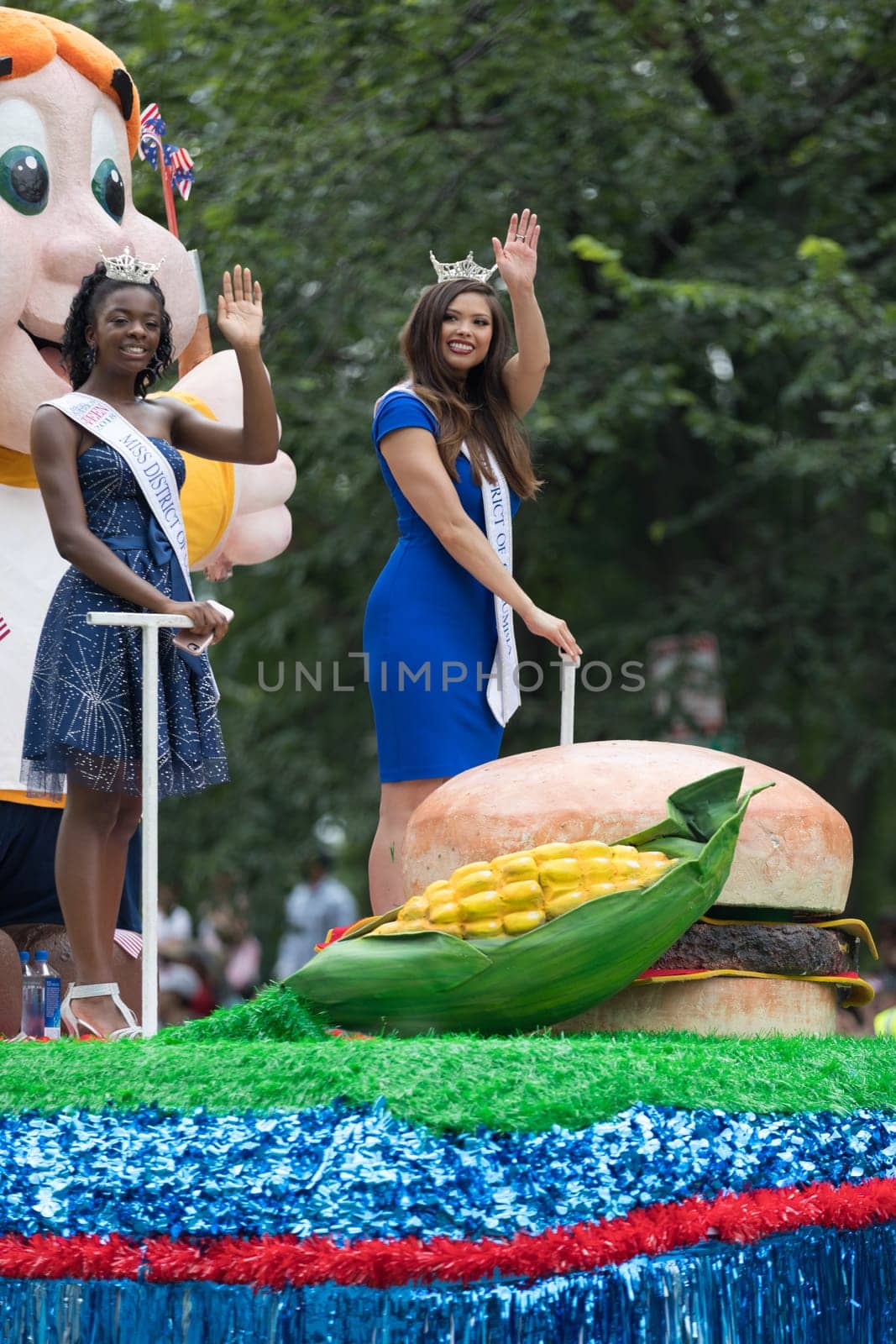 Washington, D.C., USA - July 4, 2018, The National Independence Day Parade, Group of beauty queens on a float going down constitution avenue