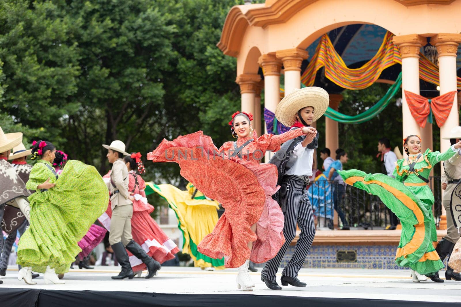 Matamoros, Tamaulipas, Mexico - November 20, 2018: The November 20 Festival, Young men and women wearing traditional mexican clothing, perform traditional mexican dances at the Plaza Miguel Hidalgo.