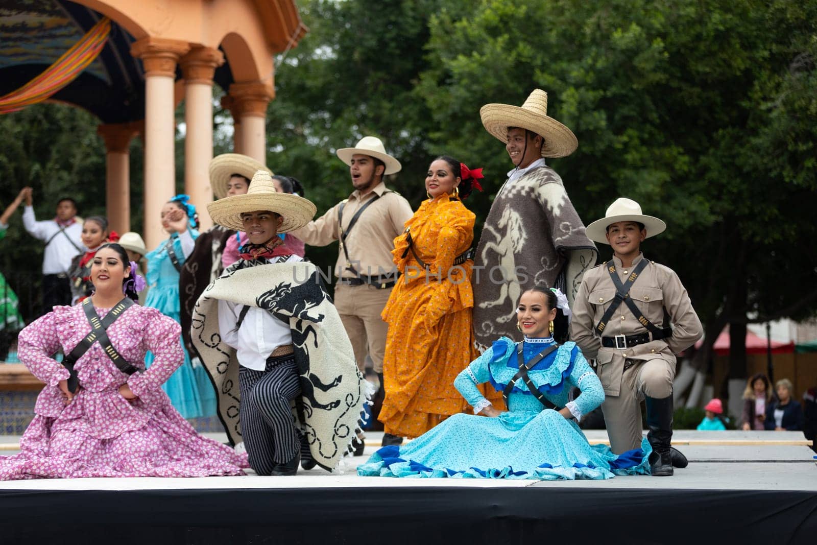 Matamoros, Tamaulipas, Mexico - November 20, 2018: The November 20 Festival, Young men and women wearing traditional mexican clothing, pose for the camera at the Plaza Miguel Hidalgo.