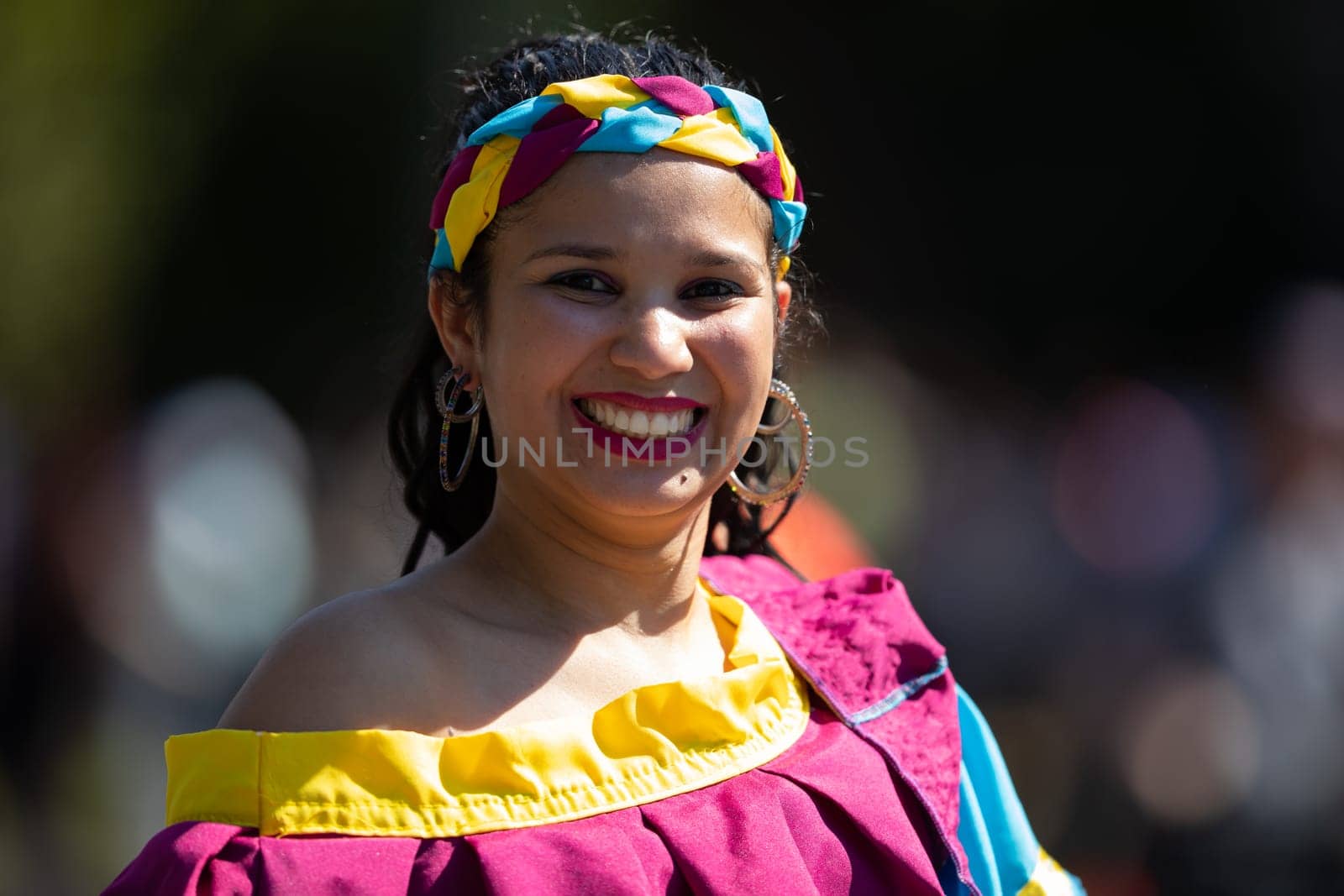 Washington, D.C., USA - September 29, 2018: The Fiesta DC Parade, Colombian woman wearing traditional colombian clothing dancing