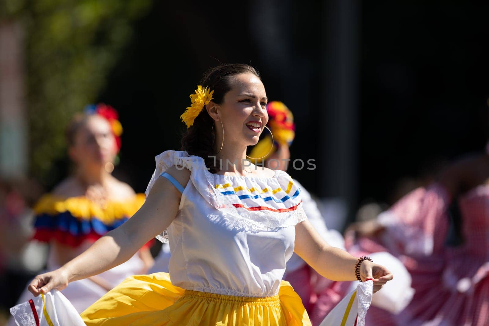 Washington, D.C., USA - September 29, 2018: The Fiesta DC Parade, Colombian woman wearing traditional colombian clothing dancing