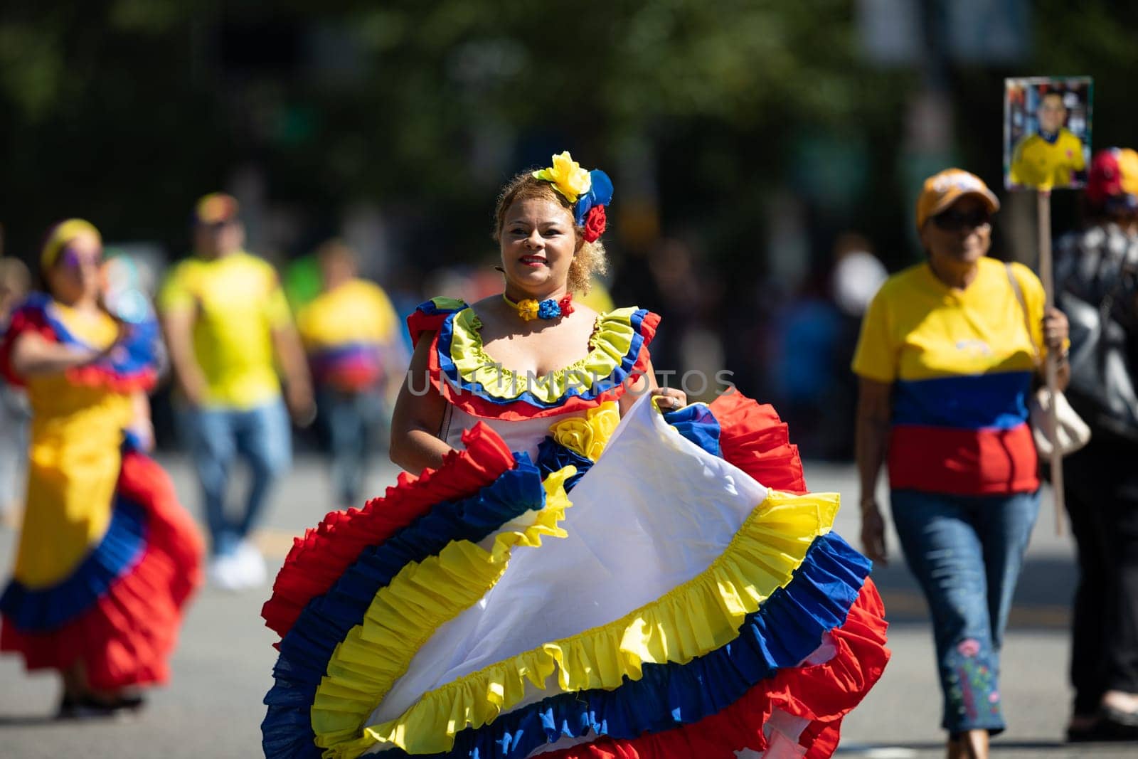 Washington, D.C., USA - September 29, 2018: The Fiesta DC Parade, Colombian woman wearing traditional colombian clothing dancing
