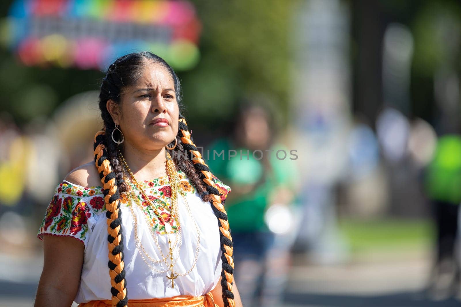 Washington, D.C., USA - September 29, 2018: The Fiesta DC Parade, woman wearing traditional clothing from Mexico going down the street