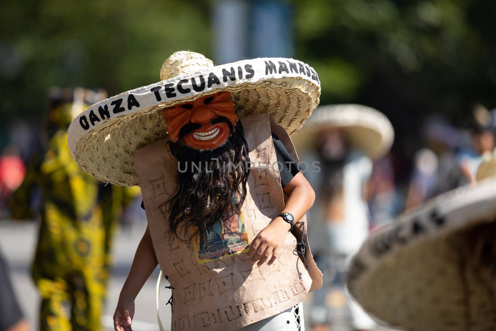 Washington, D.C., USA - September 29, 2018: The Fiesta DC Parade, Mexican man wearing an abstract face mask and a big sombrero