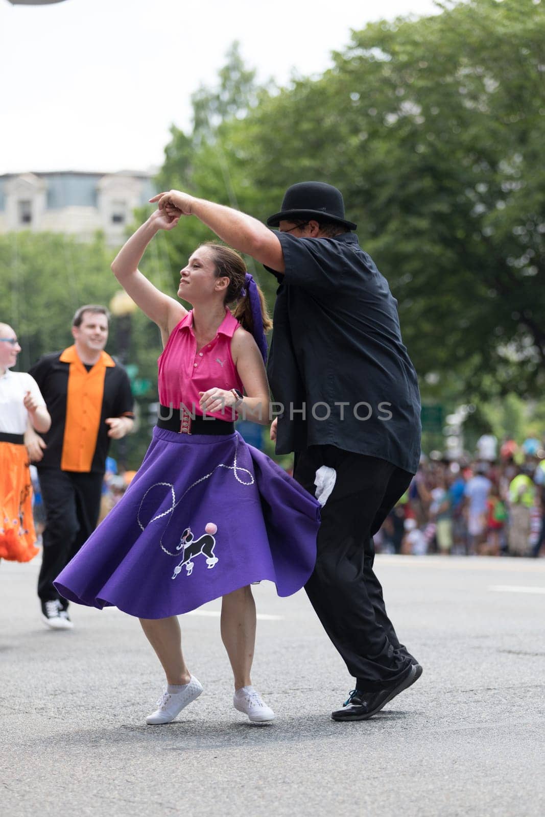 Washington, D.C., USA - July 4, 2018, The National Independence Day Parade, The Gottaswing Dancers, with outfits from the 60s, going down constitution avenue