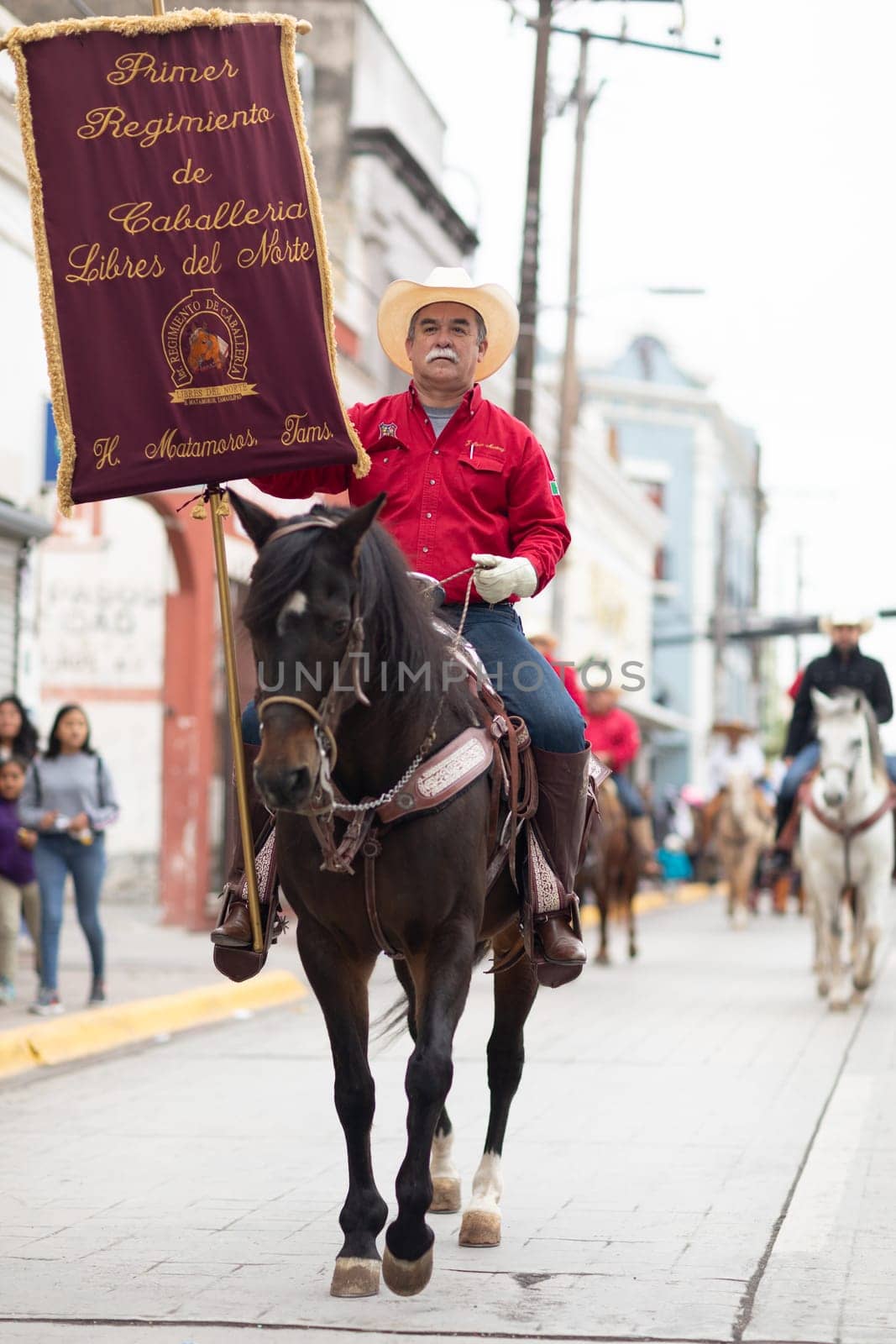 Matamoros, Tamaulipas, Mexico - November 20, 2018: The November 20 Parade, Men wearing traditional mexican clothing riding horses during the parade