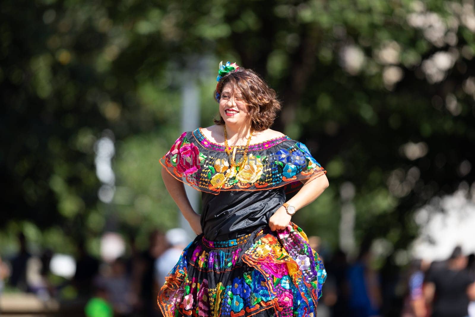 Washington, D.C., USA - September 29, 2018: The Fiesta DC Parade, Woman wearing traditional clothing from Mexico dancing