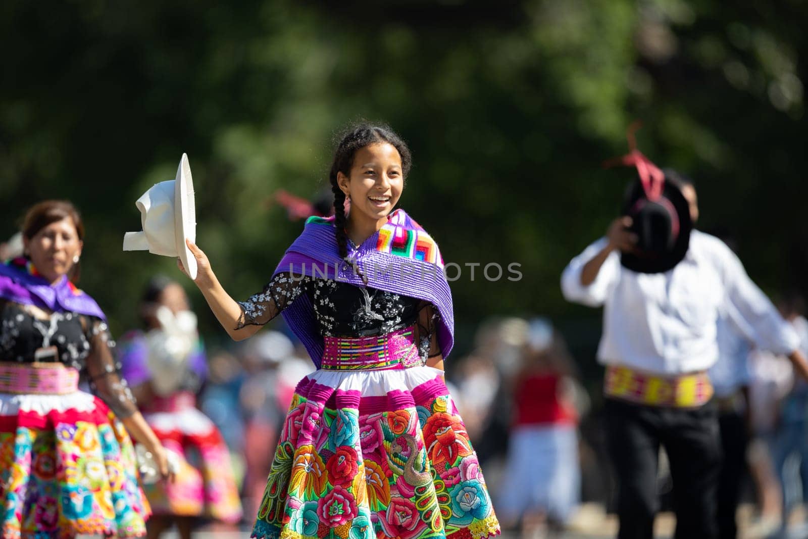 Washington, D.C., USA - September 29, 2018: The Fiesta DC Parade, Peruvian women wearing traditional clothing danicng during the parade