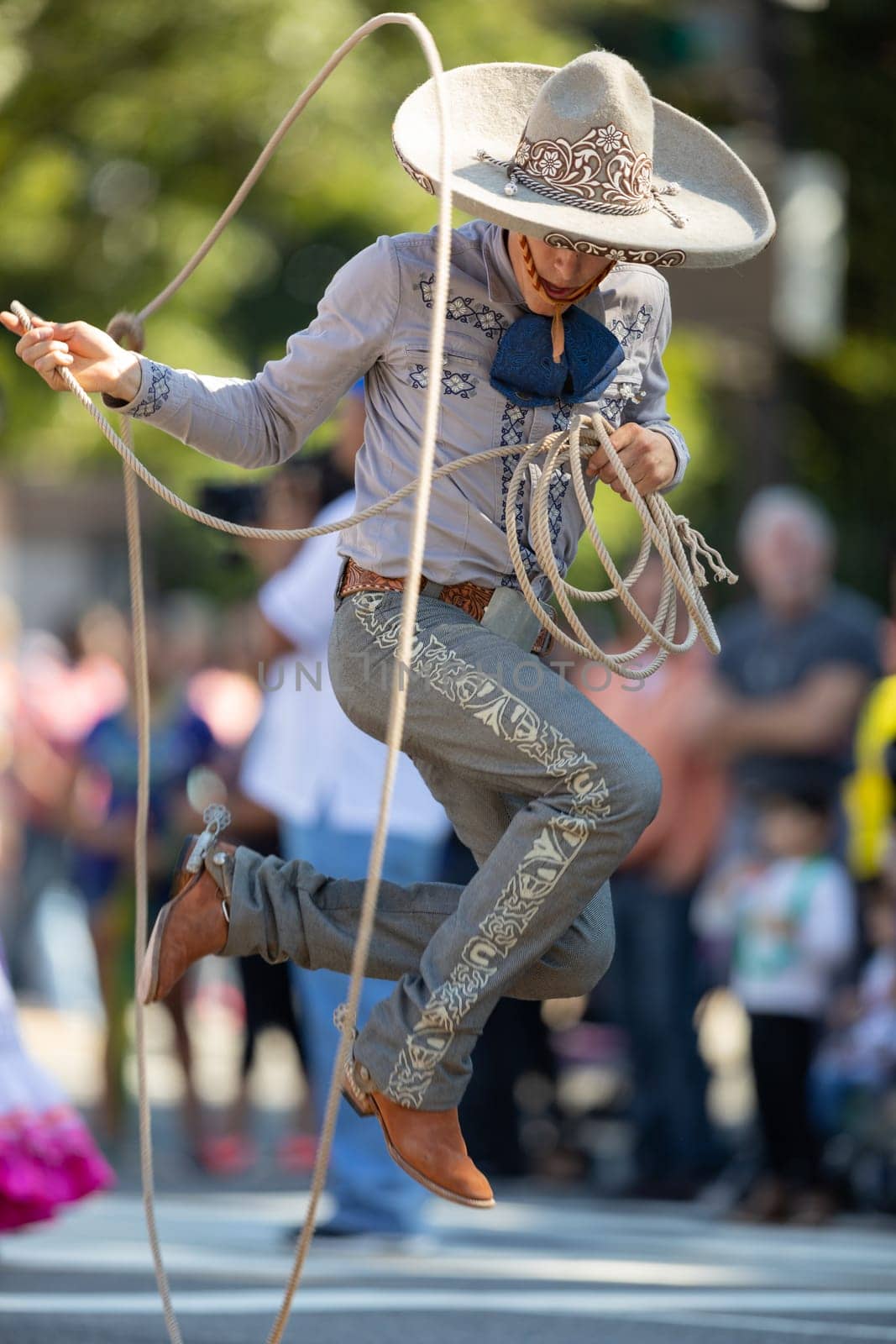 Washington, D.C., USA - September 29, 2018: The Fiesta DC Parade, Man wearing traditional clothing from Mexico handling a lasso