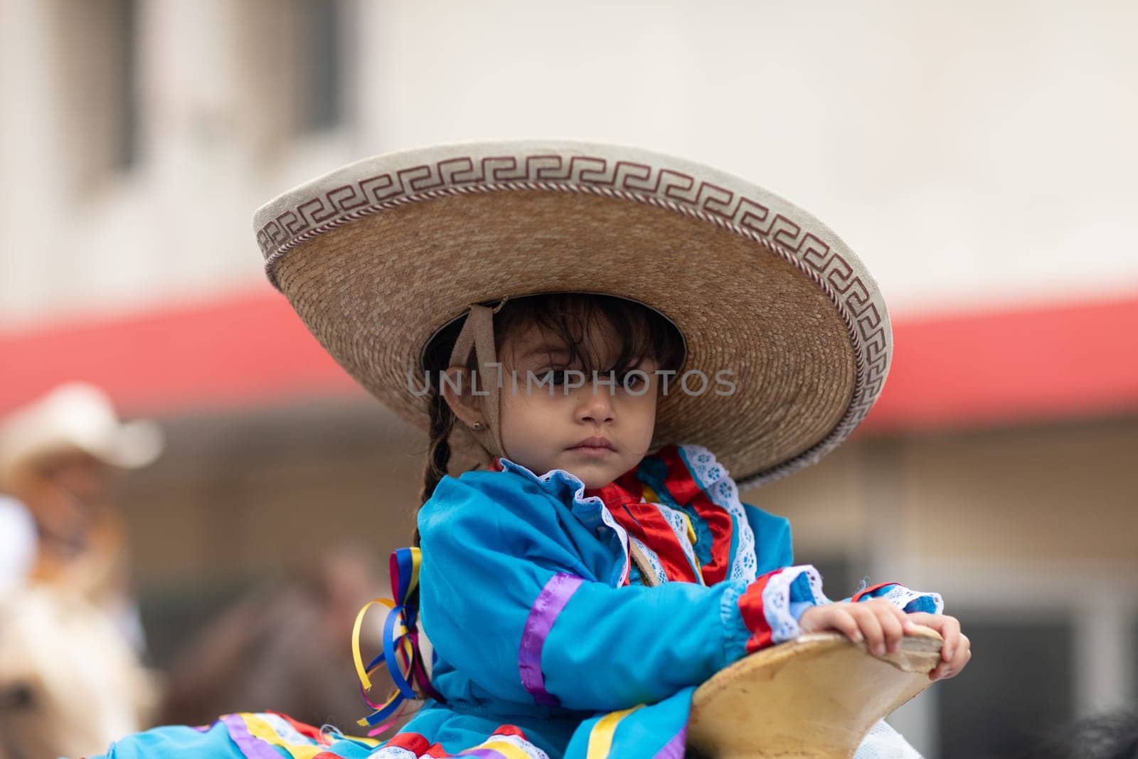 Matamoros, Tamaulipas, Mexico - November 20, 2018: The November 20 Parade, Child wearing traditional mexican clothing riding horses during the parade
