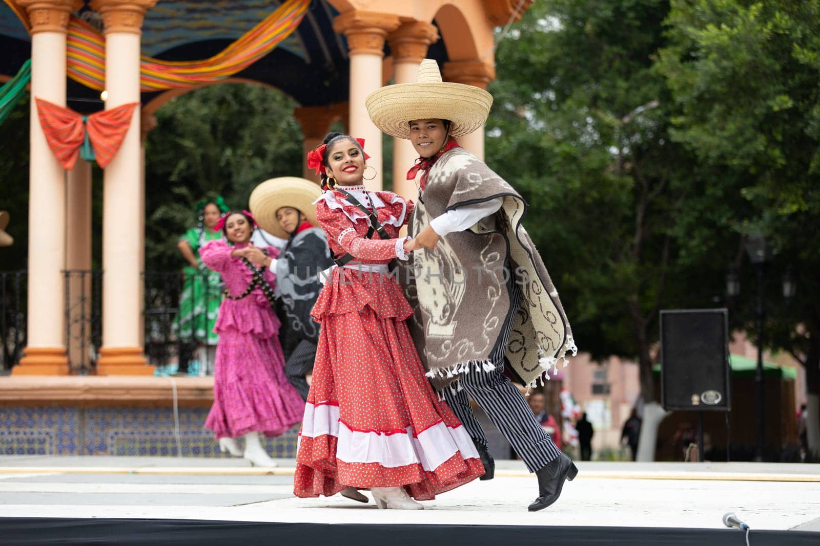 Matamoros, Tamaulipas, Mexico - November 20, 2018: The November 20 Festival, Young men and women wearing traditional mexican clothing, perform traditional mexican dances at the Plaza Miguel Hidalgo.