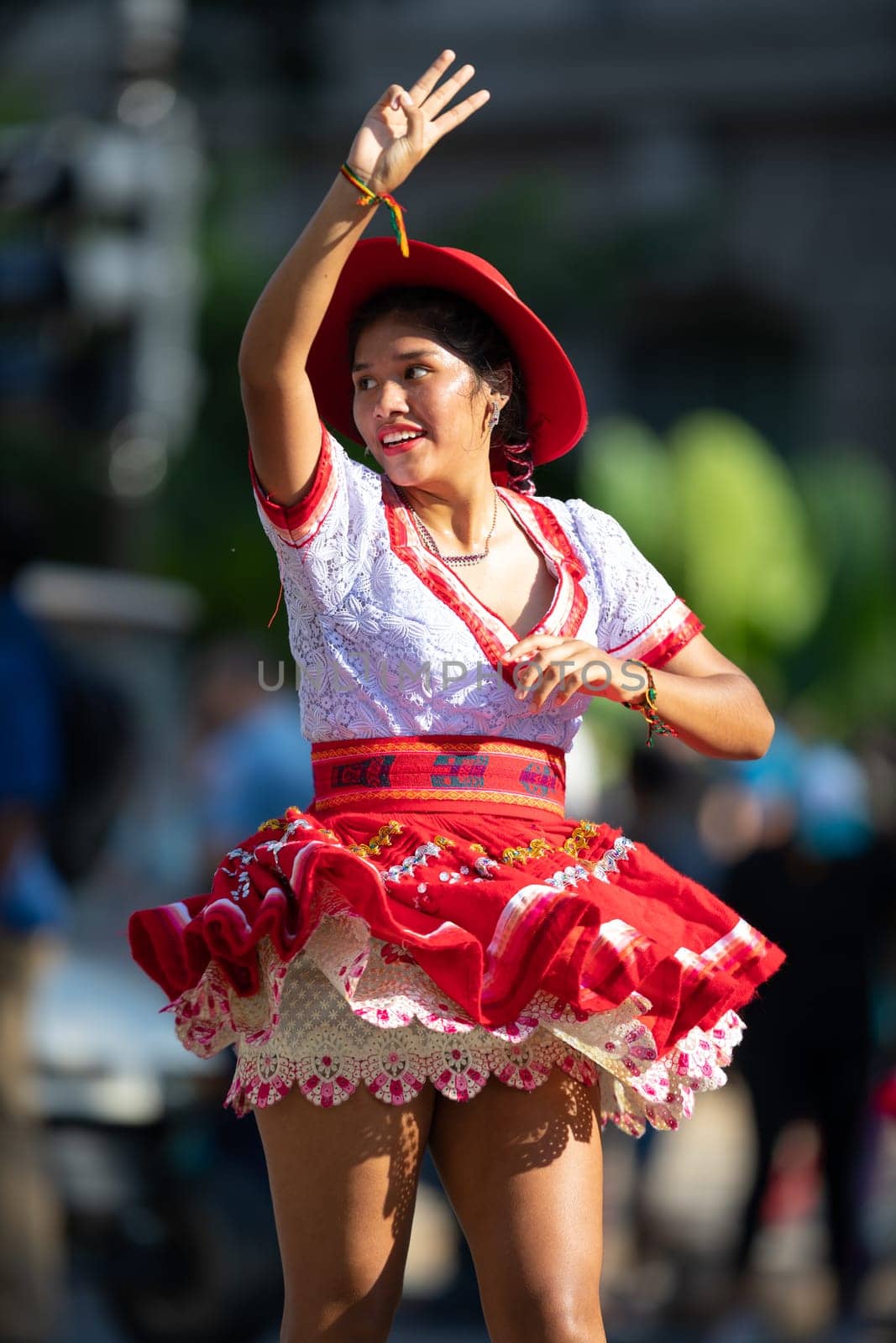 Washington, D.C., USA - September 29, 2018: The Fiesta DC Parade, Bolivian women wearing traditional clothing performing a traditional dance from bolivia