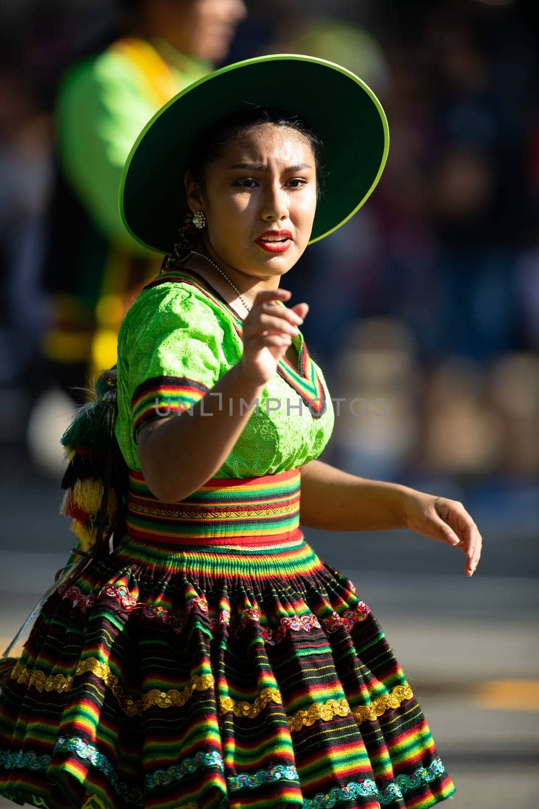 Washington, D.C., USA - September 29, 2018: The Fiesta DC Parade, Bolivian women wearing traditional clothing performing a traditional dance from bolivia