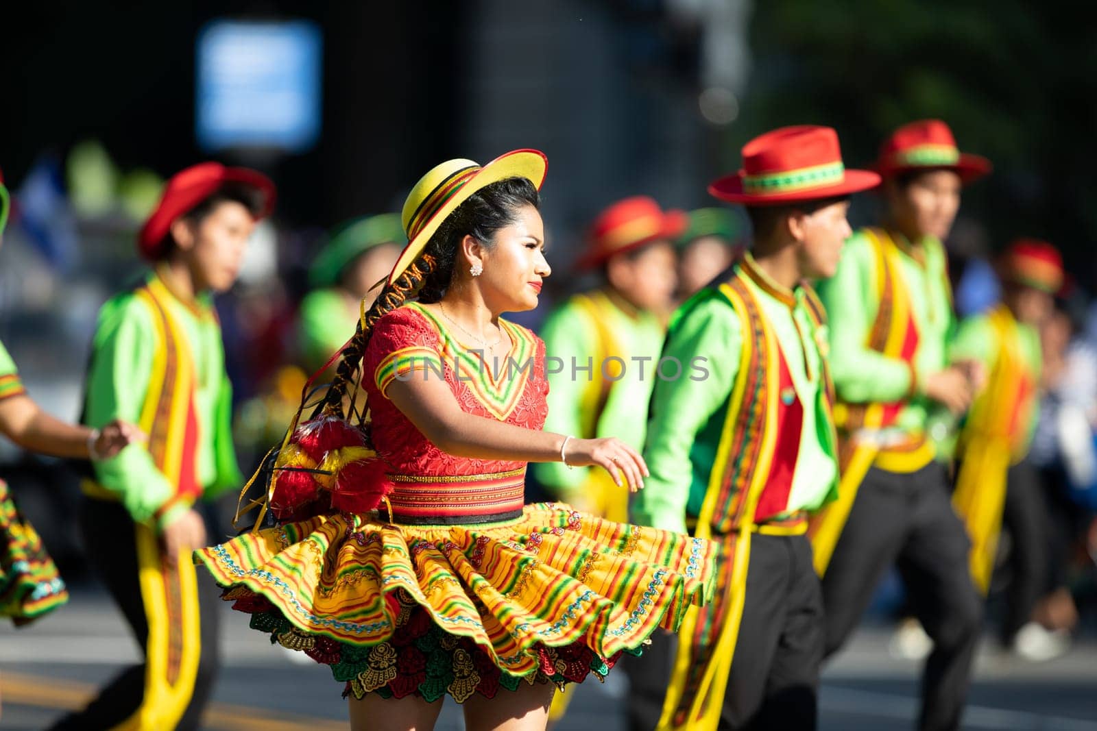 Washington, D.C., USA - September 29, 2018: The Fiesta DC Parade, Young woman and men wearing traditional bolivian clothing dancing